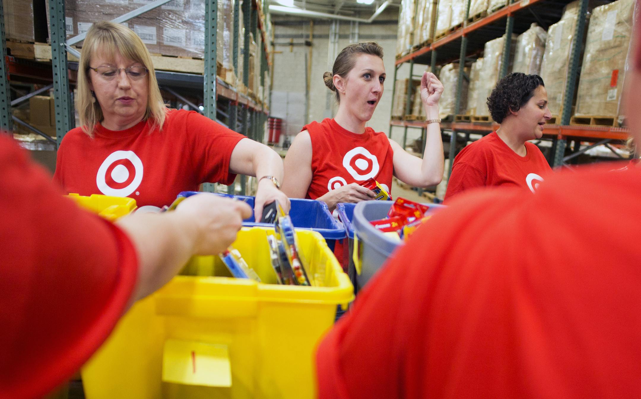 At the warehouse of Kids in Need, some 55 volunteers from Target were trying to put together more than 1800 backpacks with 20 school items in their short shift including Jenny Halek. who pumped her fist. ] Richard Tsong-Taatarii/rtsong-taatarii@startribune.com