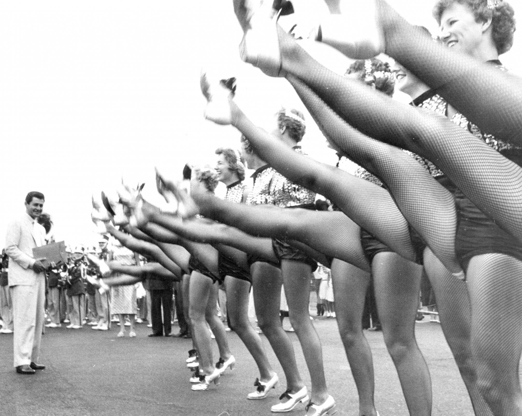 July 27, 1957: Kicking Their Heels: The Roosevelt High School Rockettes kicked up a fuss over singer Eddie Fisher when he arrived at Wold-Chamberlain airport Friday for the Aquatennial Star Night and Coronation.