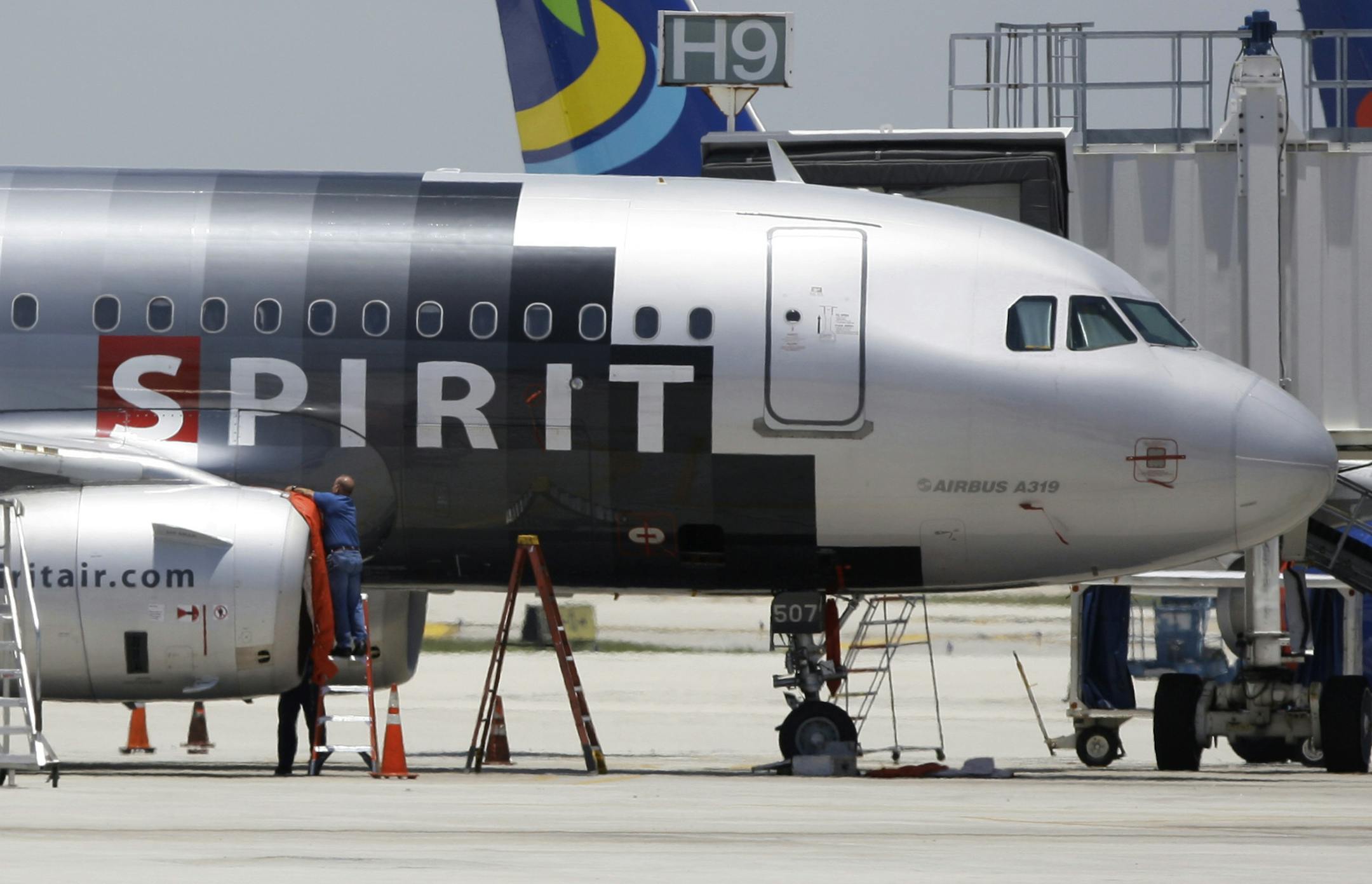 A Spirit Airlines airplane sits on the tarmac at Fort Lauderdale-Hollywood International Airport in Fort Lauderdale, Fla.