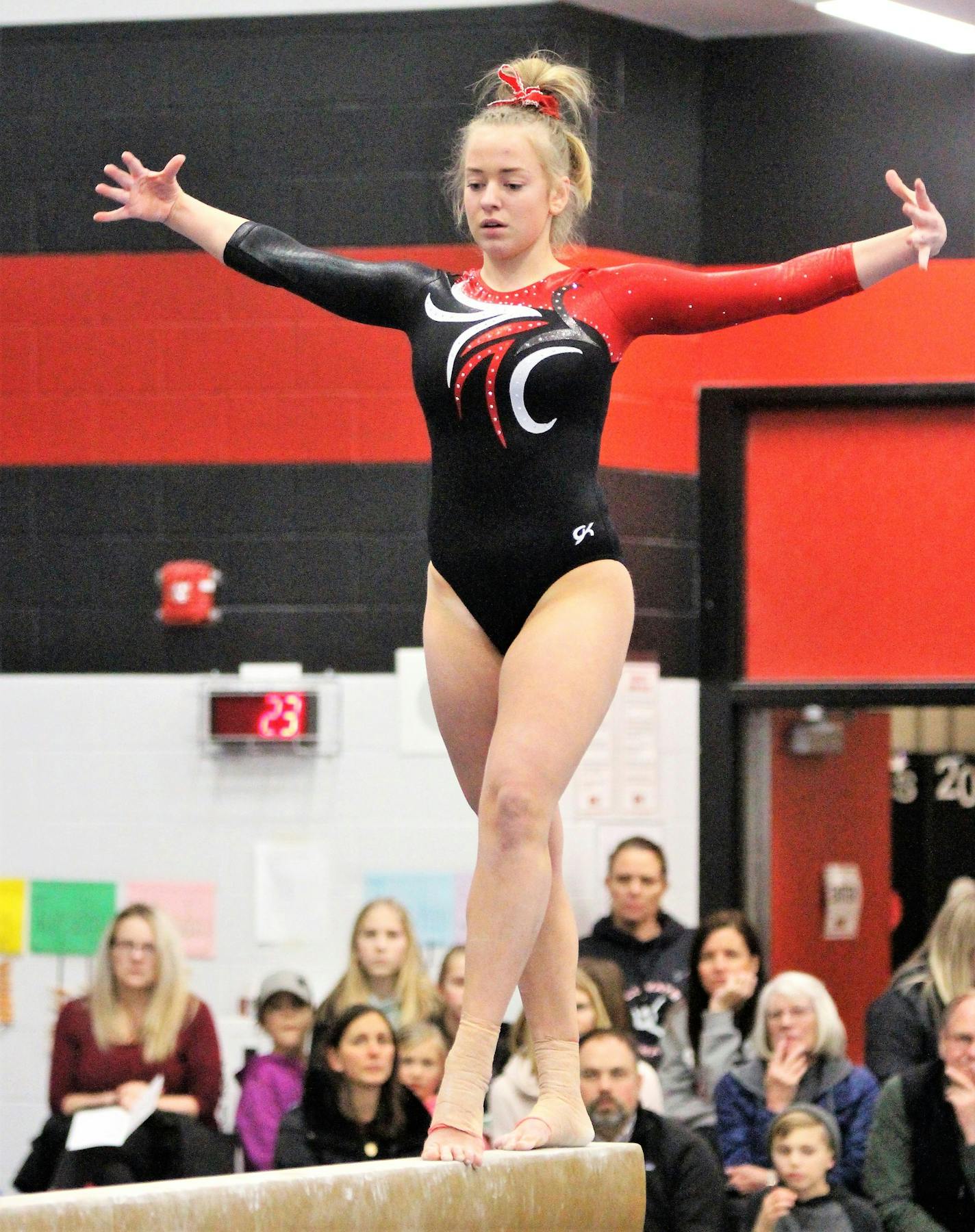 Ida Bjoerklund, a foreign exchange student from Norway, competes for Stillwate, the defending Class 2A state champion. Here, she is competing on the balance beam in a dual meet against East Ridge on Jan. 17, 2019. Photo: Stuart Groskreutz, Stillwater Gazette