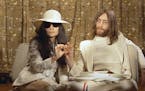 This 1969 photo shows musician John Lennon, right, and his wife Yoko Ono during a press conference. An album, "Gimme Some Truth" by John Lennon, will 