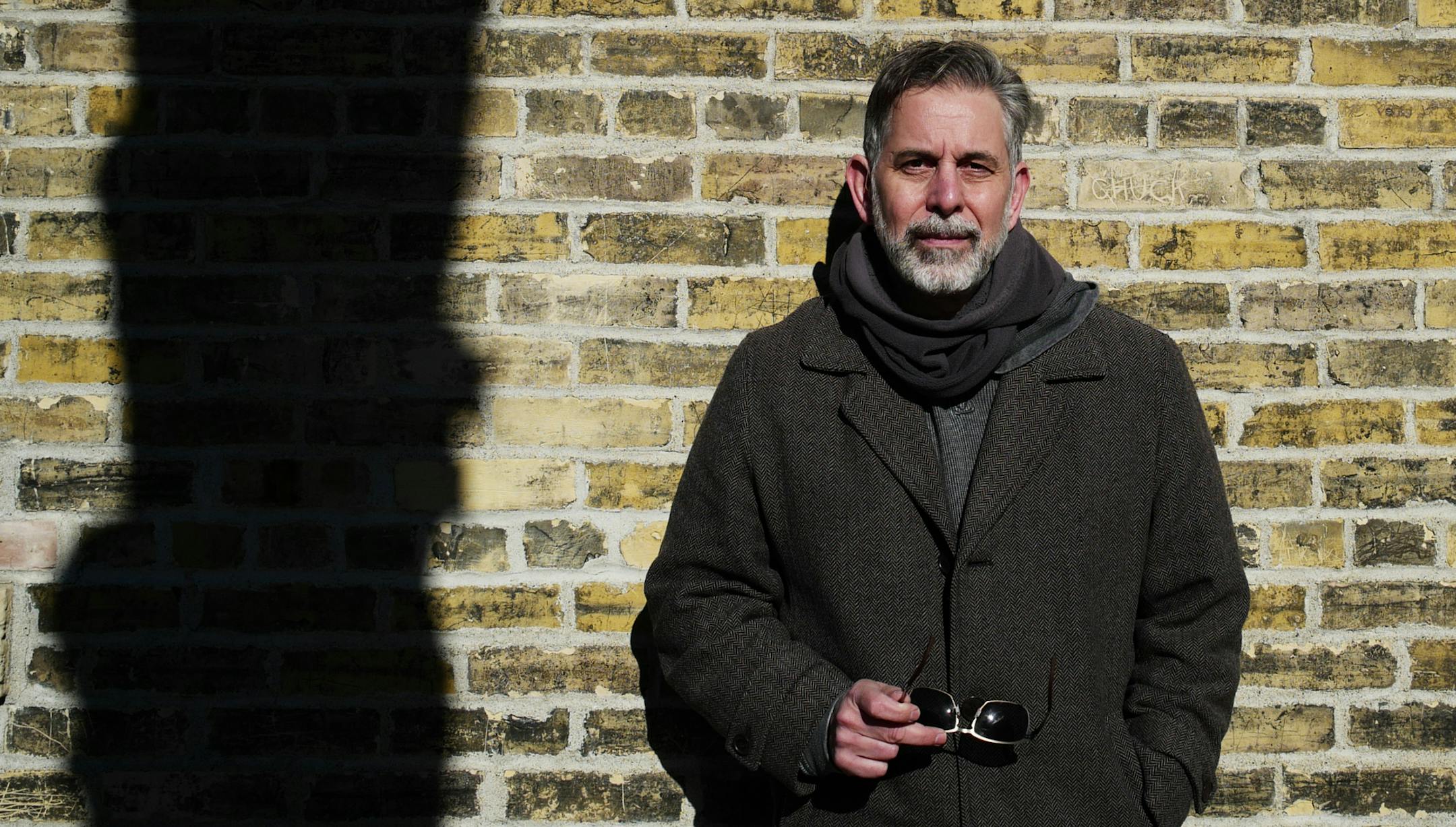 John Capecci, seen by a historic Water Works building, is working to define the identity of Minneapolis&#x2019; oldest neighborhood.