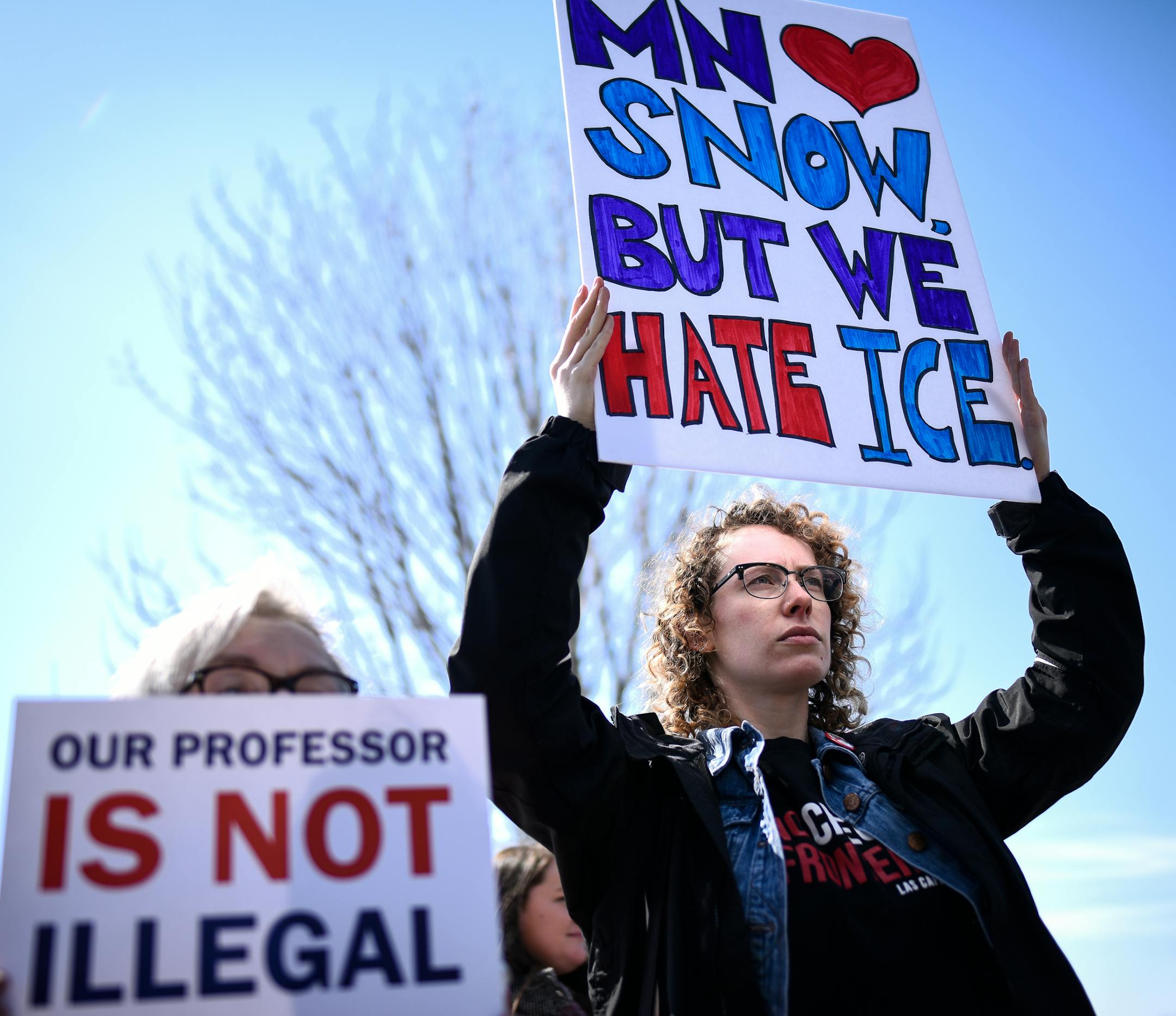 Johnnie DeWilde, left, of St. Paul, and her daughter, Elizabeth Carey demonstrated in support of Augsburg Professor Mzenga Wanyama Thursday outside the Immigration and Customs Enforcement Headquarters. ] AARON LAVINSKY ï aaron.lavinsky@startribune.com Augsburg Professor Mzenga Wanyama and his wife Mary returned to Immigration and Customs Enforcement headquarters Thursday, April 5, 2018 for another check-in to discuss the agency's plan to deport them. Wanyama emerged to a crowd of supporters