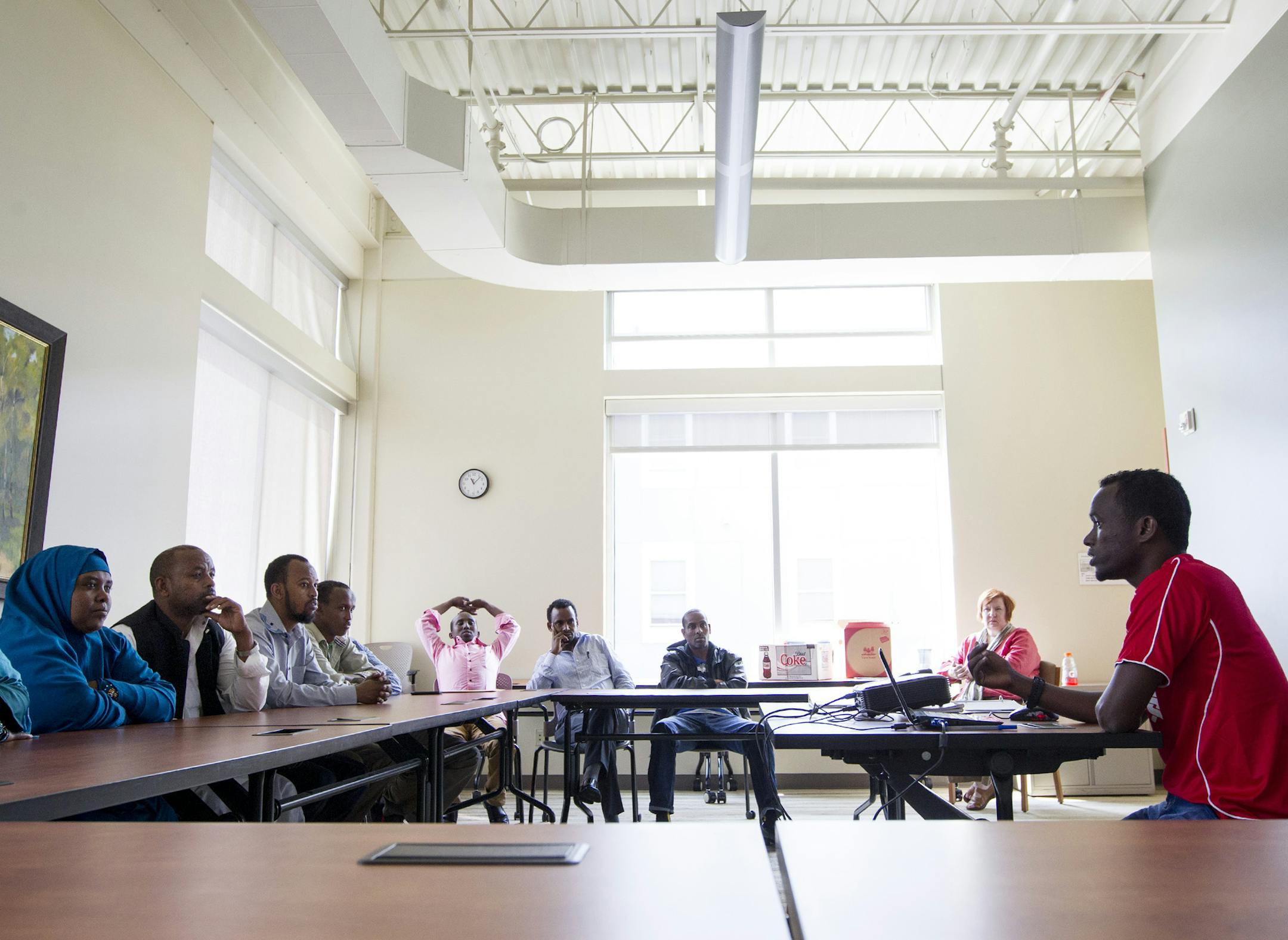 Volunteer Mohamed Ali Mohamed helps to lead a Cultural Orientation class for new Somali refugees at Lutheran Social Service of Minnesota in Minneapolis July 17, 2014. (Courtney Perry/Special to the Star Tribune)
