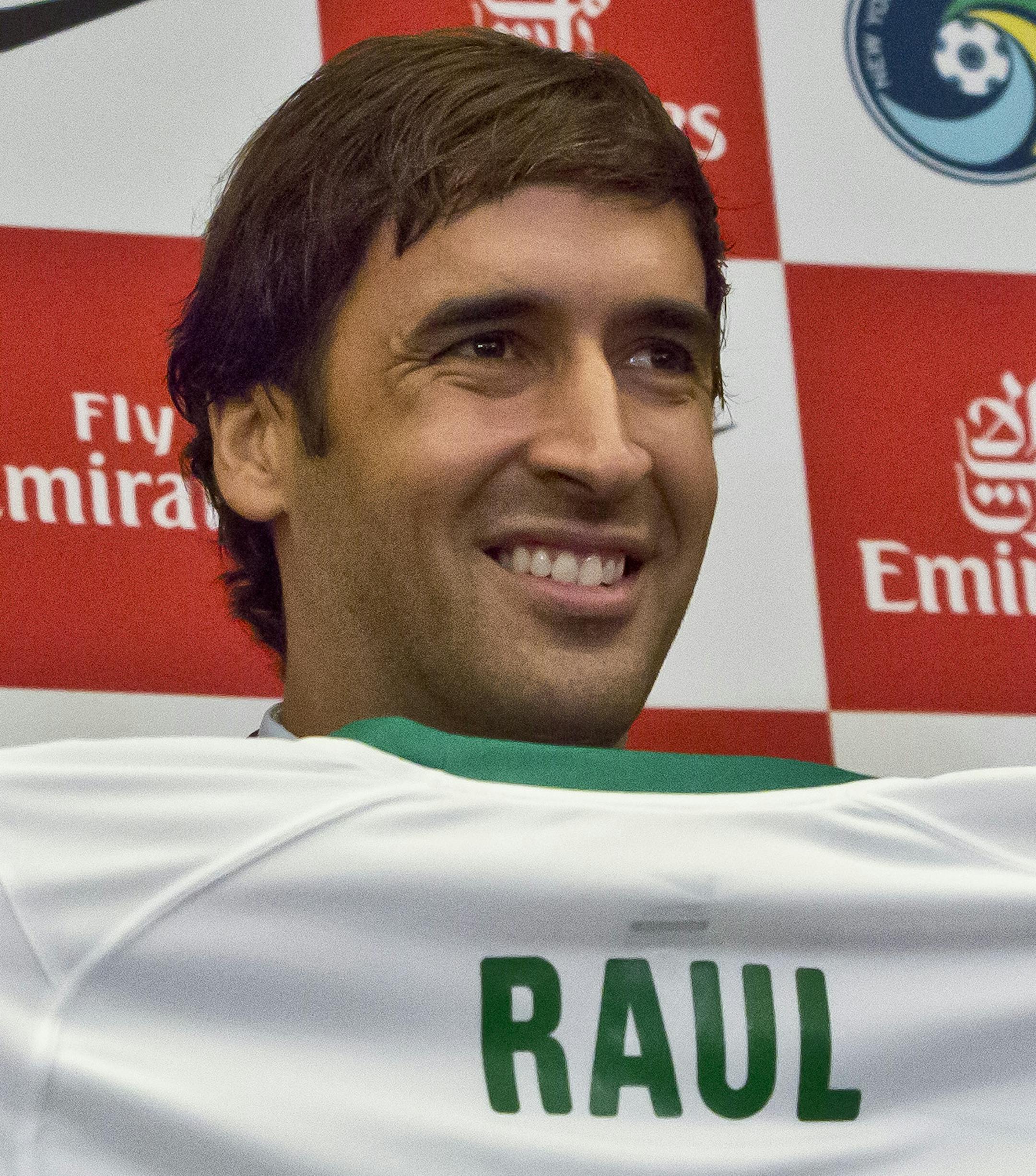 FILE - In this Dec. 9, 2014 file photo, New York Cosmos soccer coach Giovanni Savanese, left, and team chairman Seamus O'Brien, right, pose with Spain's former national team captain and former Real Madrid star Raul Gonzalez Blanco, after his introduction as the team's newest member in New York. Gonzalez Blanco, popularly known as Raul, announced on Thursday, Oct. 15, 2015 that he'll retire from active football at the end of the season the North American Soccer League (NASL) in November. (AP Phot