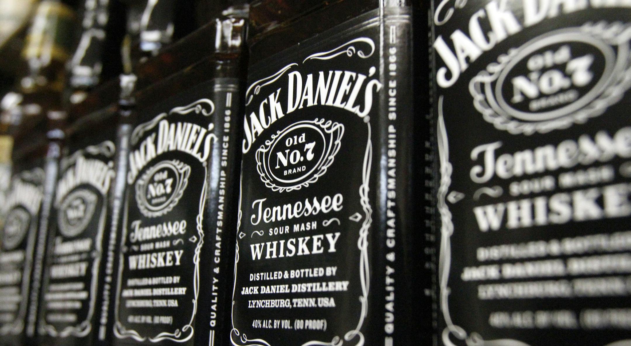 FILE - In this Dec. 5, 2011, file photo, bottles of Jack Daniel's Tennessee Whiskey line the shelves of a liquor outlet in Montpelier, Vt. Spirits maker Brown-Forman Corp. said Wednesday, Aug. 31, 2016, its first-quarter net income fell 7 percent as challenging foreign exchange conditions hampered its performance in emerging overseas markets and the loss of its Southern Comfort brand cut into overall sales. (AP Photo/Toby Talbot, File)
