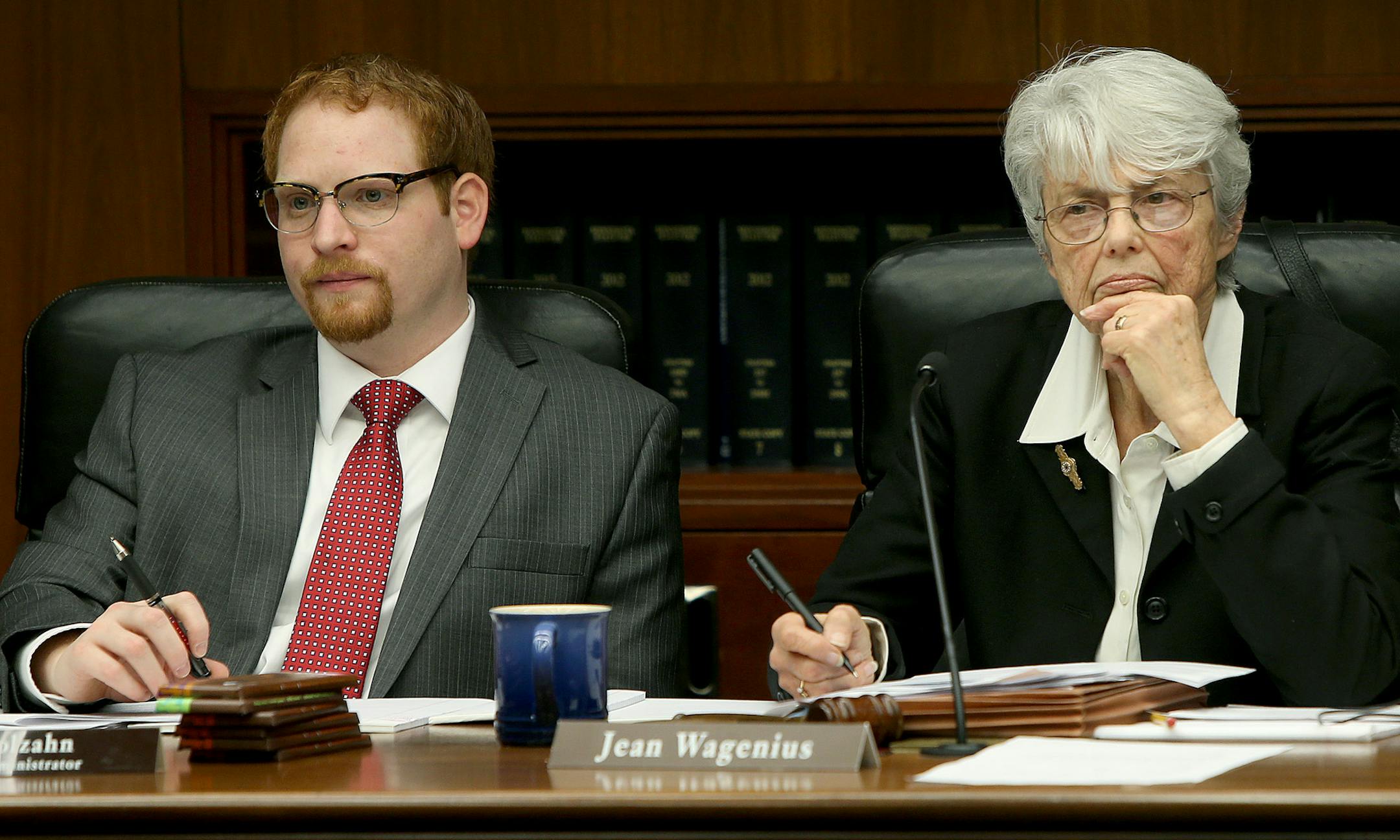 Mike Molzahn, left, and Rep. Jean Wagenius, the Chair of the Environment, Natural Resources, and Agriculture Finance Committee, listened to Jess Richards, the Director of the Division of Lands and Minerals, Tuesday.