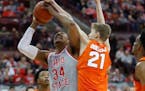 Ohio State's Kaleb Wesson, left, is fouled by Syracuse's Marek Dolezaj during the second half of an NCAA college basketball game Wednesday, Nov. 28, 2