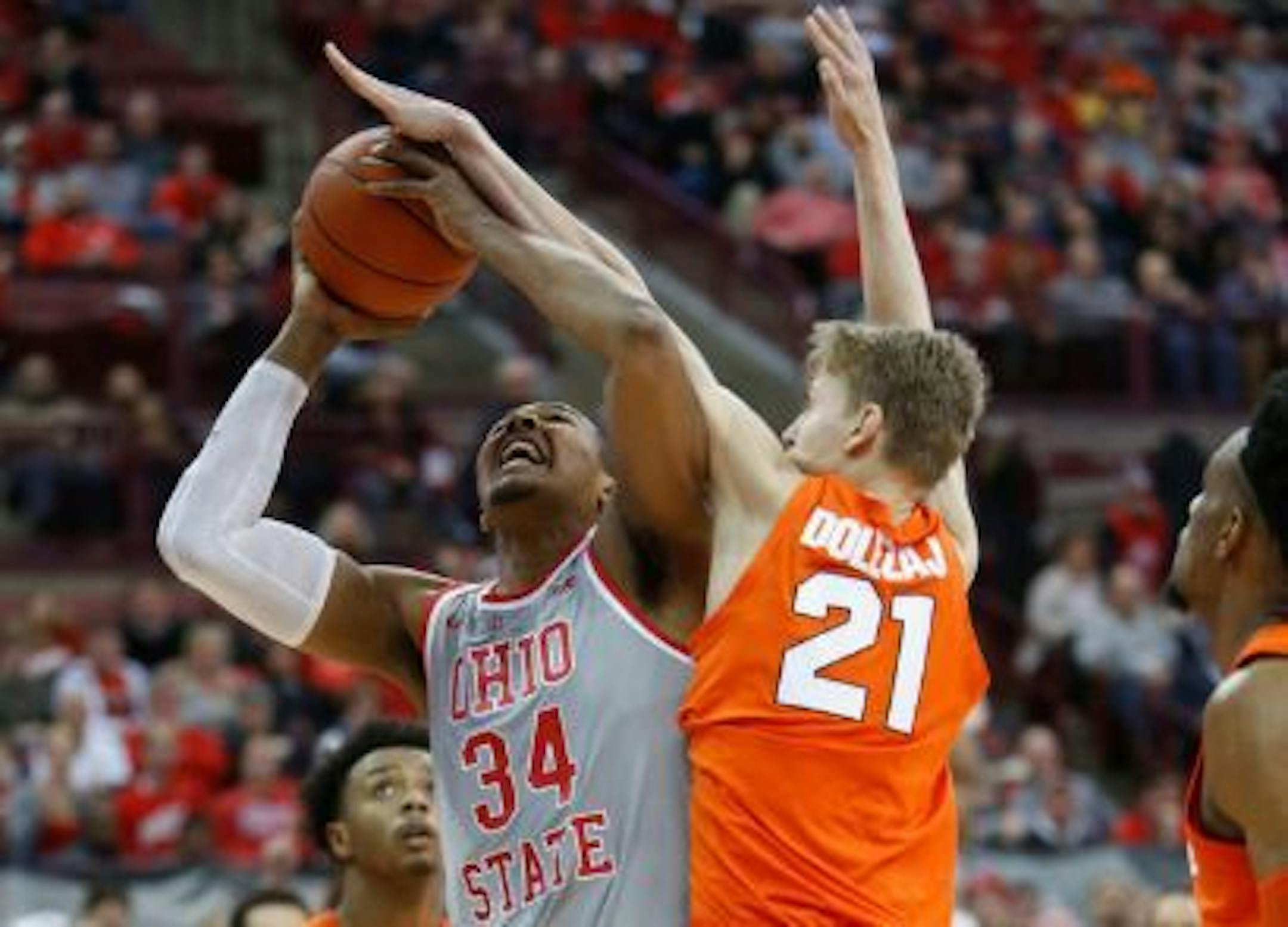 Ohio State's Kaleb Wesson, left, is fouled by Syracuse's Marek Dolezaj during the second half of an NCAA college basketball game Wednesday, Nov. 28, 2018, in Columbus, Ohio. Syracuse beat Ohio State 72-62.