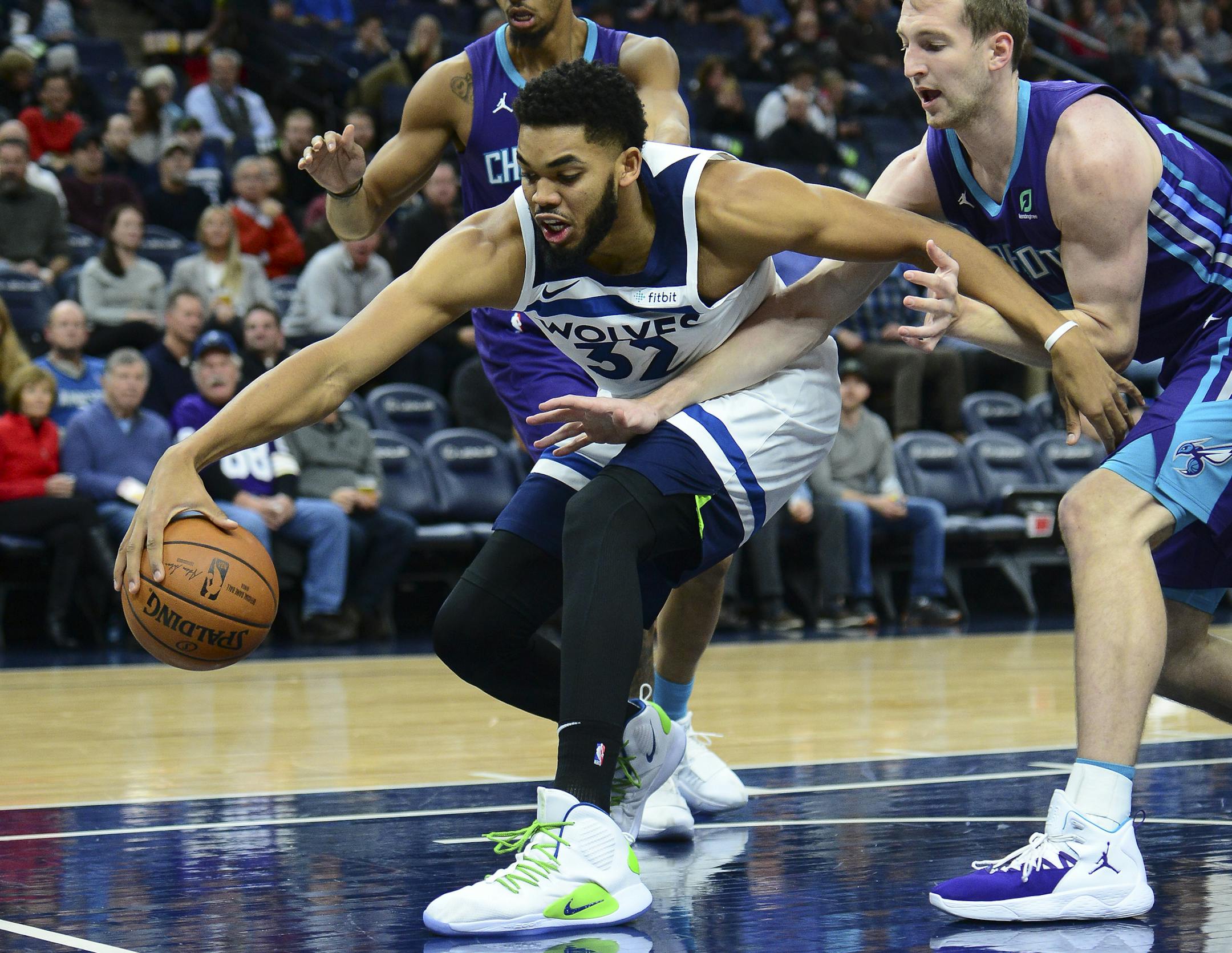 Minnesota Timberwolves center Karl-Anthony Towns (32) battled for a rebound with Charlotte Hornets center Cody Zeller (40) in the first half. ] Aaron Lavinsky • aaron.lavinsky@startribune.com The Minnesota Timberwolves played the Charlotte Hornets on Wednesday, Dec. 5, 2018 at Target Center in Minneapolis, Minn.