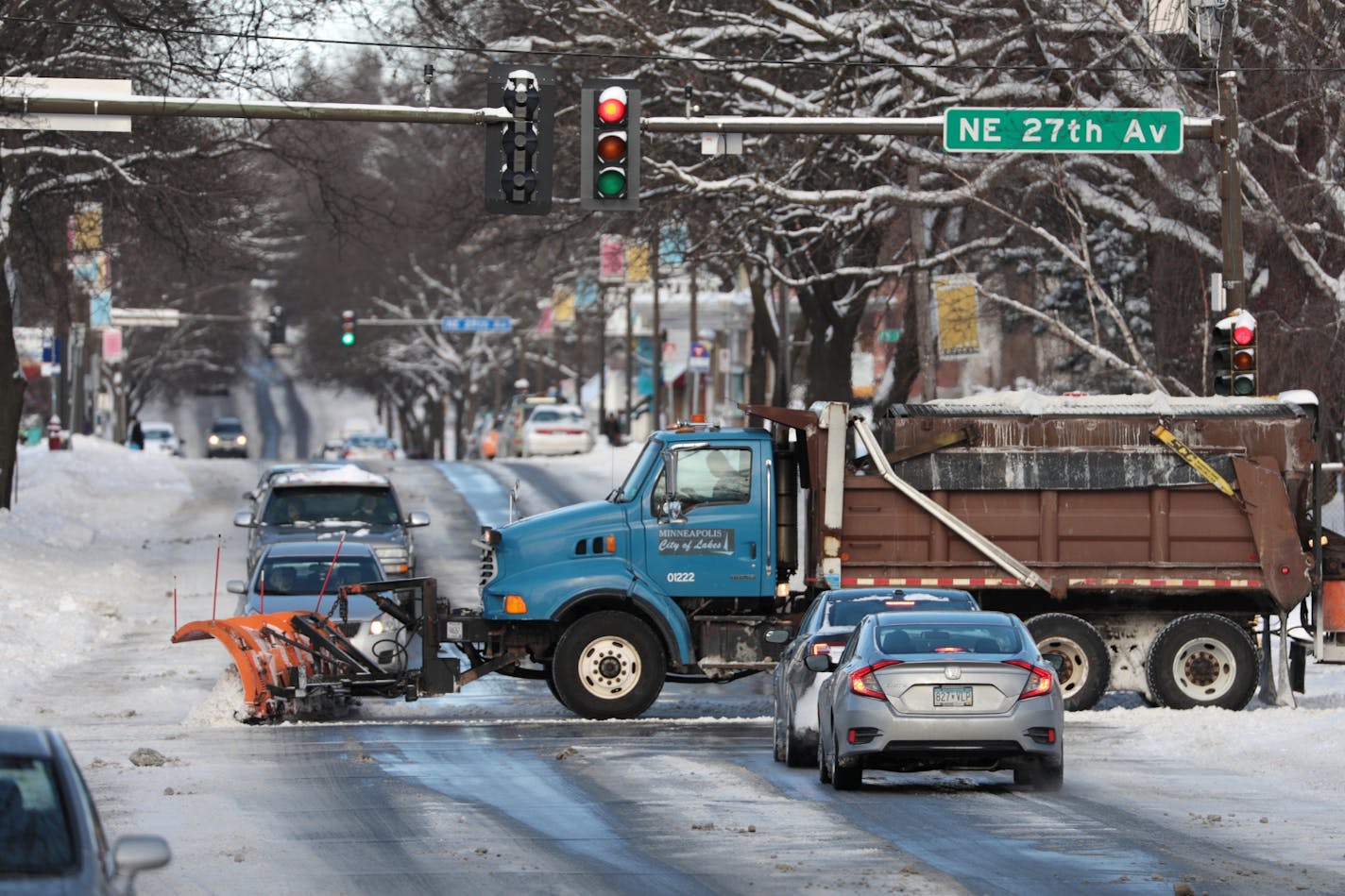 A Minneapolis plow truck cleared 27th Avenue NE. on Saturday afternoon. After the snowfall, the temperature was to plunge into the minus-20s.