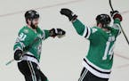Dallas Stars center Tyler Seguin (91) celebrates his third goal of the game with teammate Jamie Benn (14) during the third period of an NHL hockey gam