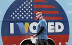 Robb Rehfeld wears a mask as he walks to cast his vote during a special election for California's 25th Congressional District seat Tuesday, May 12, 20