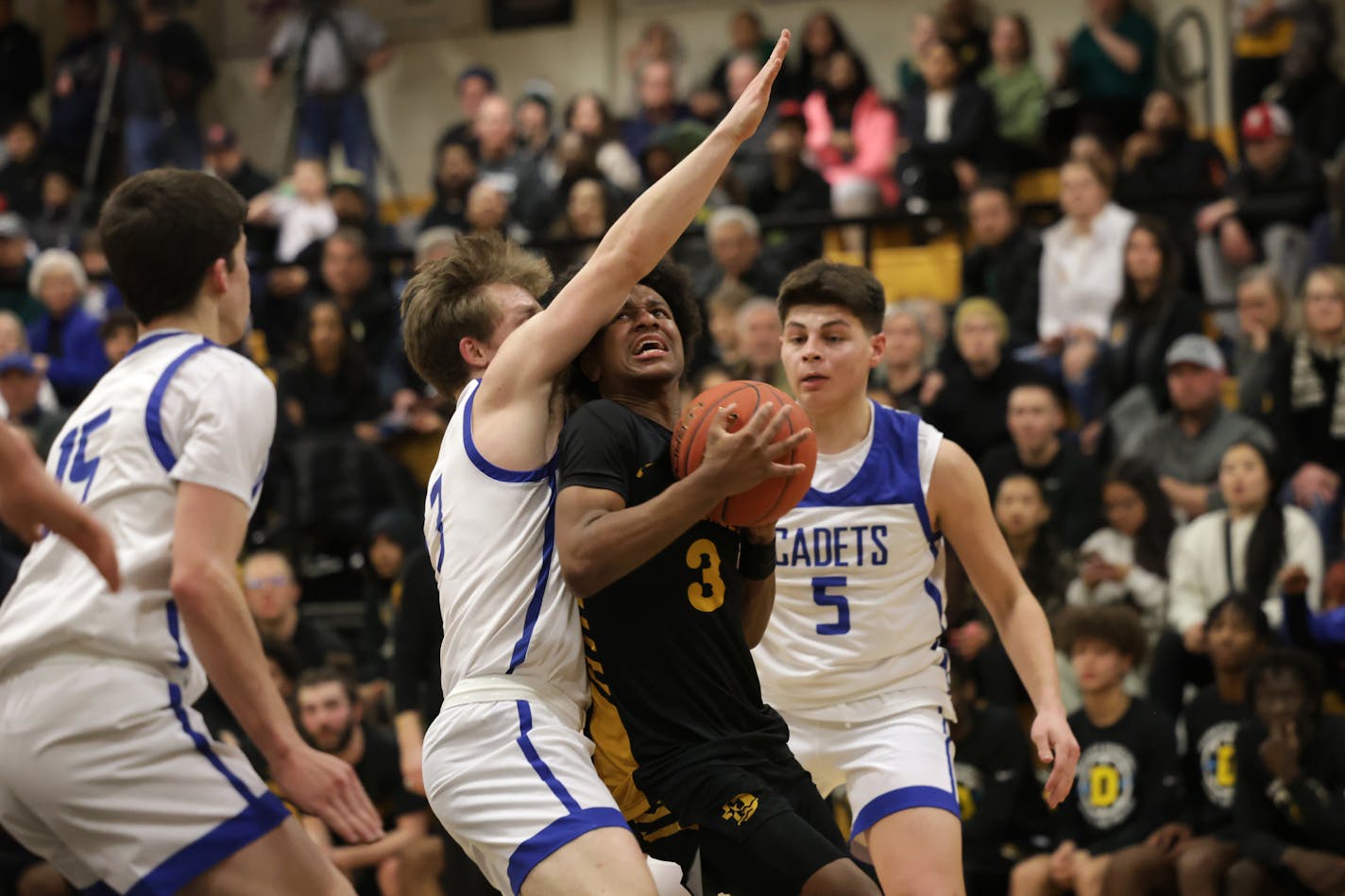 DeLaSalle's Nasir Whitlock drives the lane through St. Thomas Academy defender Michael Kirchner (3).