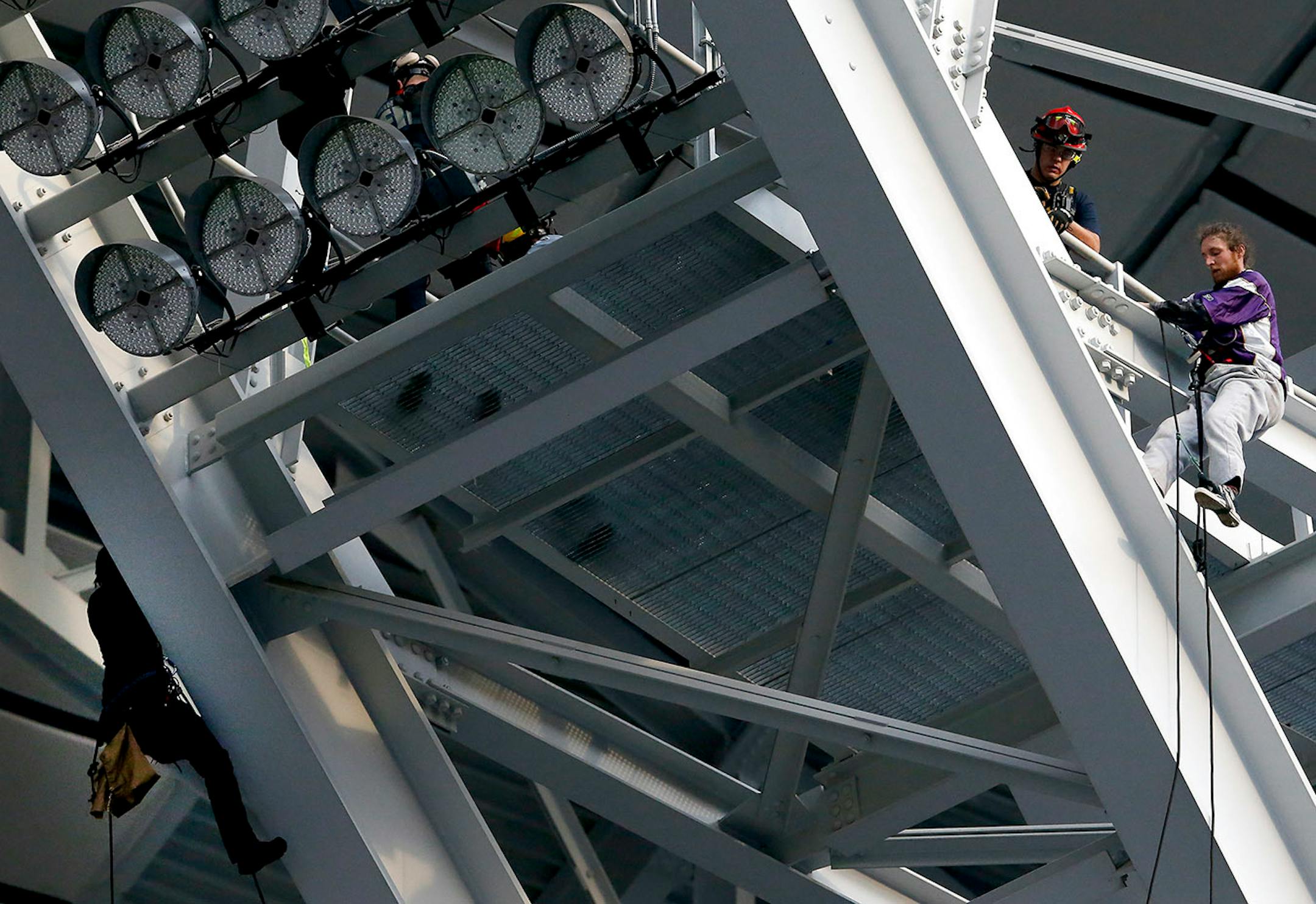 #NoDAPL protesters were met by emergency crews after climbing back up to the rafter at the end of the game. @NoDAPL protesters hung a sign from the rafters of US Bank Stadium during the Minnesota Vikings vs. Chicago Bears Game.