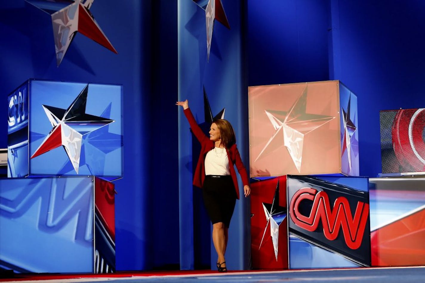 Rep. Michele Bachmann (R-Minn.) walks on stage during the CNN Tea Party Republican Debate at the Florida State Fairgrounds in Tampa, Fla., on Sept. 12, 2011. Eight Republican presidential candidates squared off with host Wolf Blitzer.