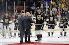 Pacific Division forward John Scott, center, is named most valuable player after the NHL hockey All-Star championship game Sunday, Jan. 31, 2016, in N