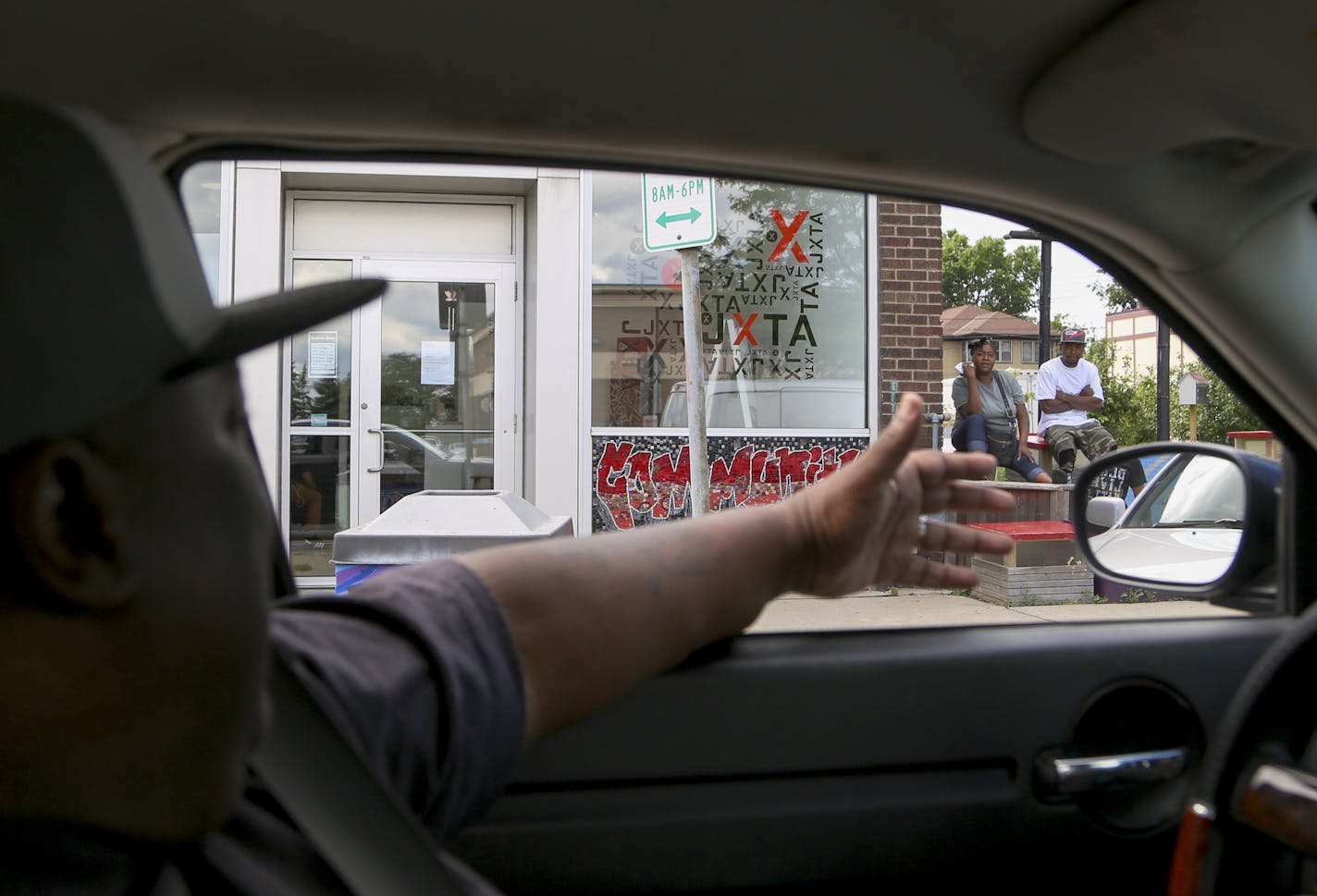 Ferome Brown spoke with passers-by while running errands. Brown is a popular figure among north Minneapolis residents, often receiving greetings, waves and the occasional honked car horn hello.