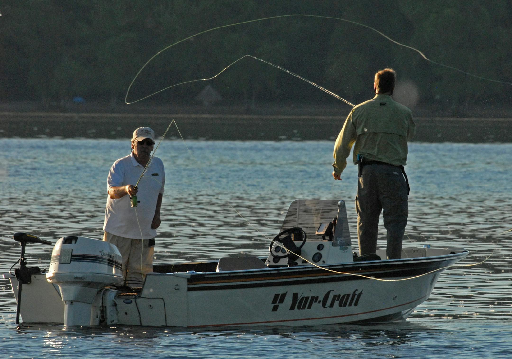 Bob Nasby, left, and Dale Wiehe cast flies for smallmouth bass Thursday morning on the St. Croix River.