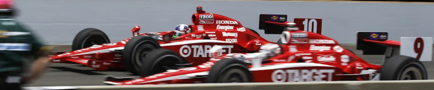 IndyCar drivers Scott Dixon, right, of New Zealand, and teammate Dario Franchitti, of Scotland, race down the front straightaway during the Indianapolis 500 auto race at the Indianapolis Motor Speedway in Indianapolis, Sunday, May 29, 2011. (AP Photo/Darron Cummings)