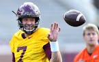 Gophers quarterback Mitch Leidner joked with a trainer during practice prior to Saturday's scrimmage.