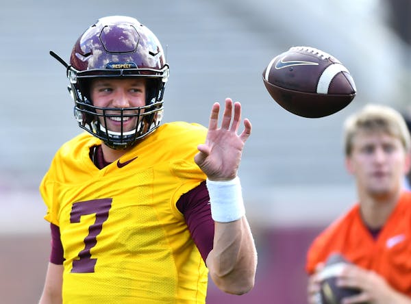 Gophers quarterback Mitch Leidner joked with a trainer during practice prior to Saturday's scrimmage.