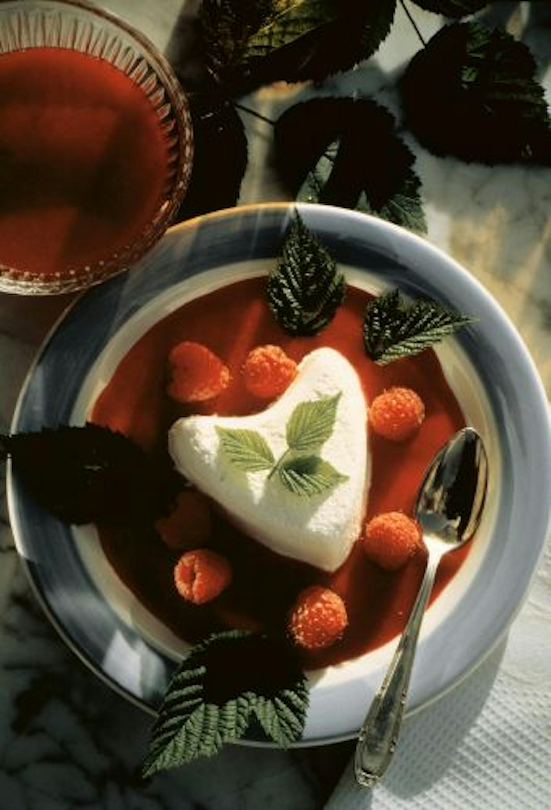 Coeur a la crème dessert with raspberry sauce.