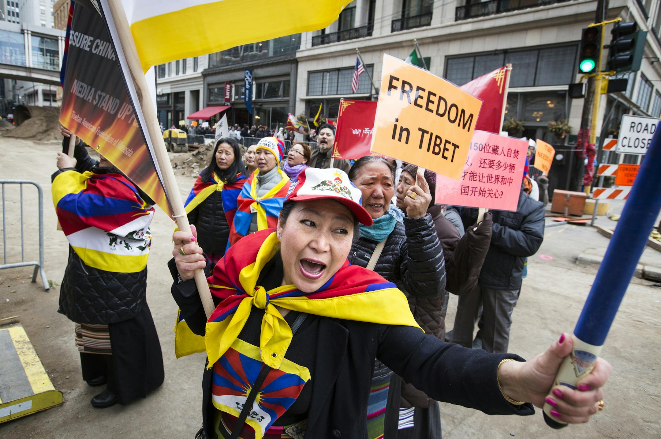 Ngawang Tara of Richfield, a member of the Tibetan Women's Association, chants while marching with others for Tibet in downtown Minneapolis. ] (Leila Navidi/Star Tribune) leila.navidi@startribune.com BACKGROUND INFORMATION: Local Tibetans and supporters gather at the Hennepin County Government Center in downtown Minneapolis on Thursday, March 10, 2016 to recognize Tibetan National Uprising Day. This day, March 10, marks the 57th anniversary of the Tibetan people's uprising in 1959 against the pr