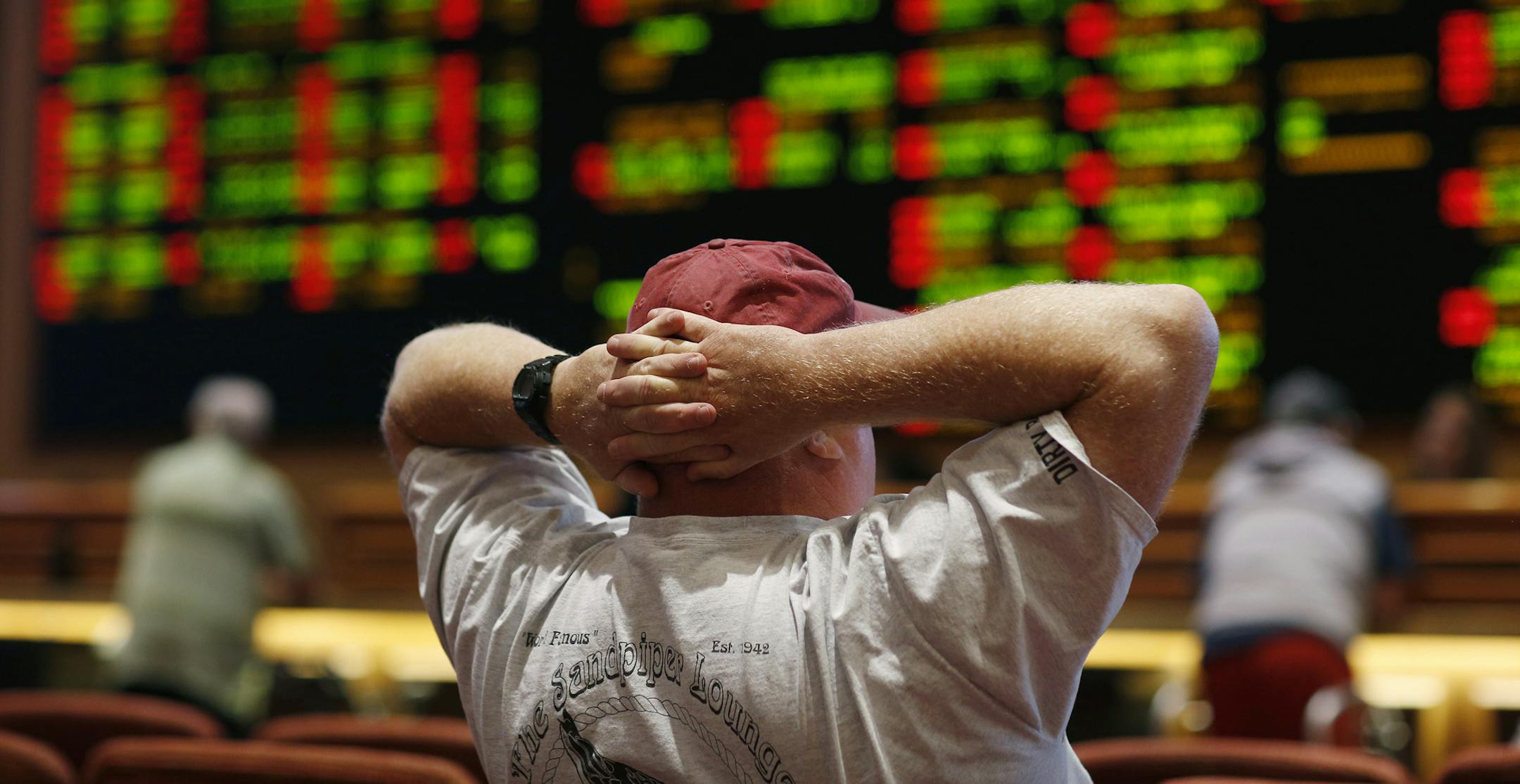A man watches a baseball game in the sports book at the South Point hotel-casino, Monday, May 14, 2018, in Las Vegas. The Supreme Court on Monday gave its go-ahead for states to allow gambling on sports across the nation, striking down a federal law that barred betting on football, basketball, baseball and other sports in most states. (AP Photo/John Locher)