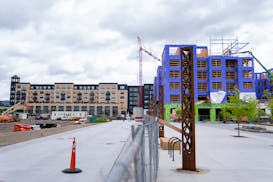 A completed Lunds & Byerlys, an apartment complex and Marvella, a senior housing unit under construction, left to right, at the Highland Bridge site i