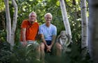 Tom Hayden and Jay Peterson have spent almost 30 years creating their Beautiful Gardens winner in Minnetonka. They posed for a photo on a stone bench 