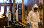 A cleaning crew works at the Capitol in Washington on Thursday, Jan. 7, 2021. President Donald Trump’s efforts to overturn the 2020 presidential ele