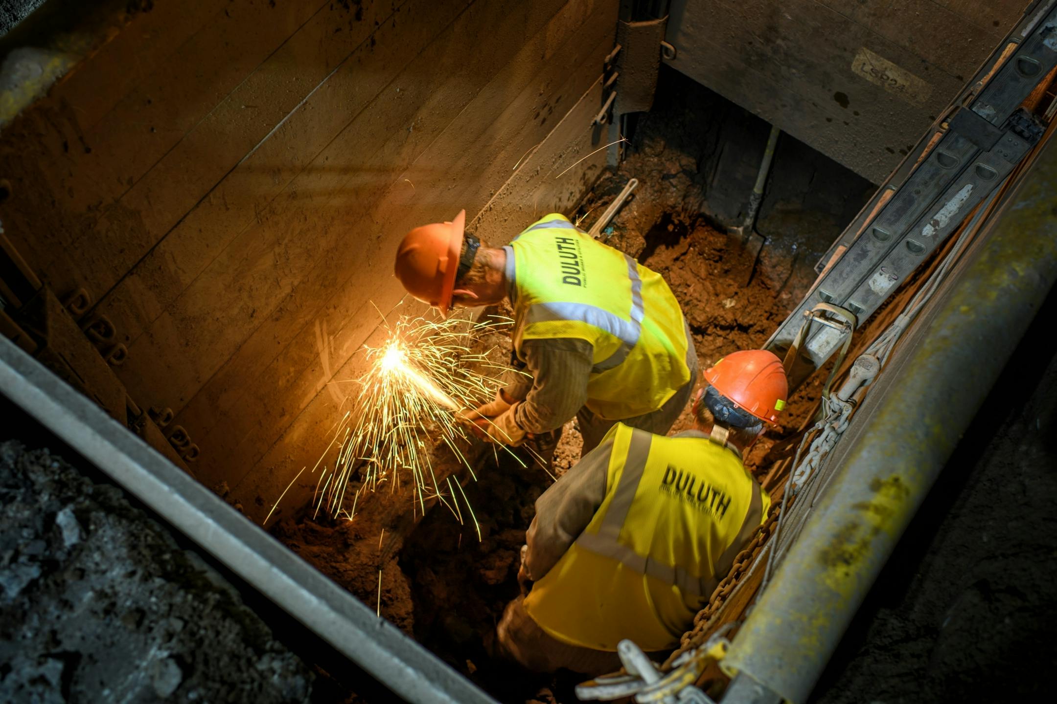 Workers from Duluth Public Works and Utilities Department replace a broken water main valve at Grand Avenue and 40th Ave West. Work was done overnight to avoid disrupting traffic during the day.