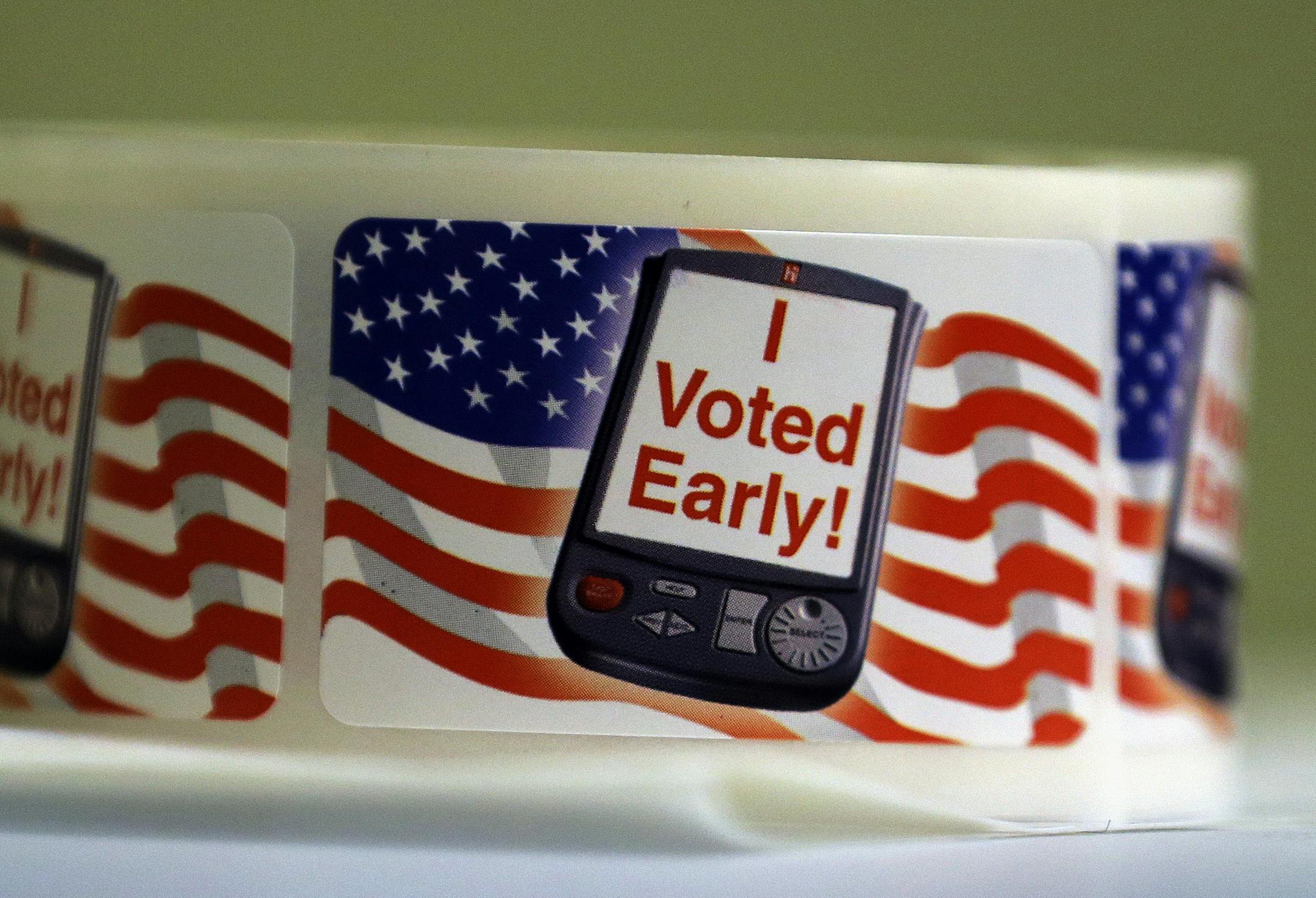 In this Wednesday, Feb. 26, 2014 photo, "I Voted Early" stickers are seen at an early voting polling site, in Austin, Texas. In elections that begin next week, voters in 10 states will be required to present photo identification before casting ballots _ the first major test of voter ID laws after years of legal challenges arguing that the measures are designed to suppress voting. (AP Photo/Eric Gay)