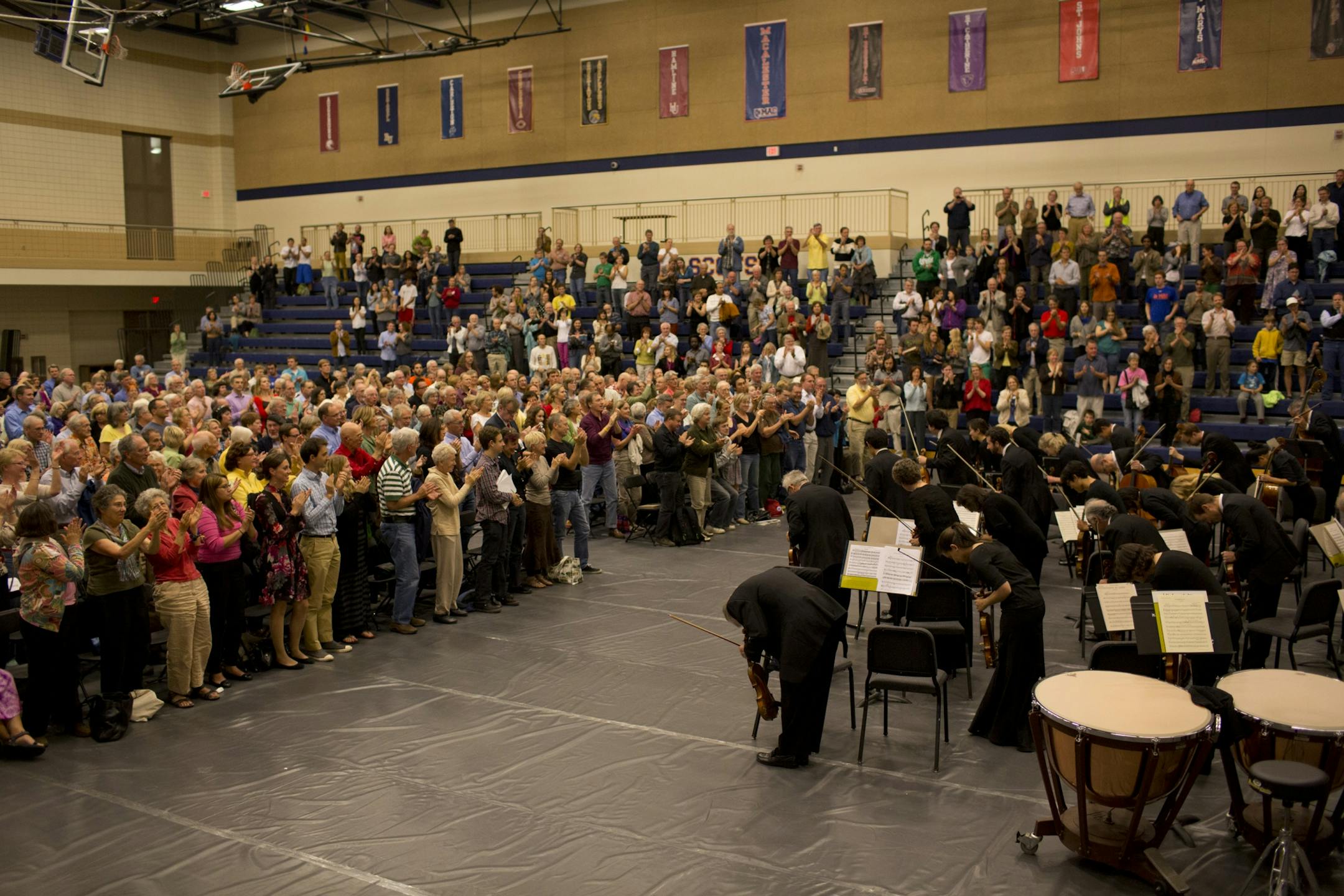 The musicians of the St. Paul Chamber Orchestra, entrenched in contract talks with management, were looking to drum up public support by presenting a free concert Tuesday night, October 2, 2012 in the Leonard Center Gymnasium on the Macalester College campus in St. Paul, Minn. The gymnasium audience gave the SPCO musicians a standing ovation when the took their places for Tuesday night's community concert.