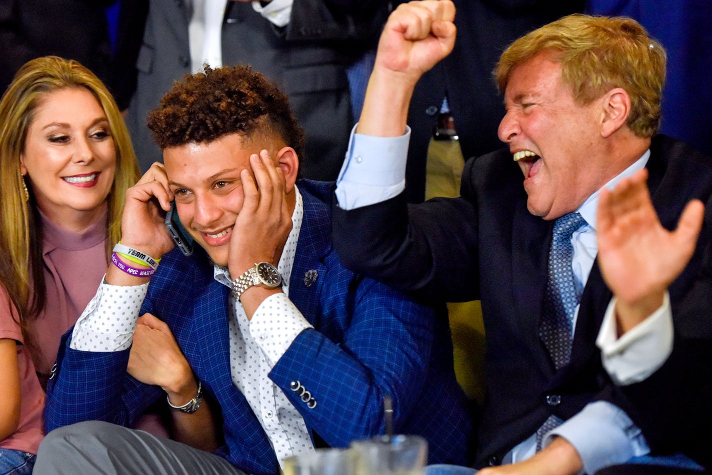 Randi Martin, Patrick Mahomes and Leigh Steinberg reacted while Mahomes was on a call with the Kansas City Chiefs during an NFL football draft watch party in Tyler, Texas.