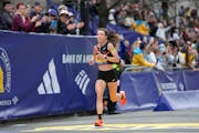 Emma Bates of Elk River crosses the finish line of the Boston Marathon on Monday, finishing as the top American woman for the second year in a row.