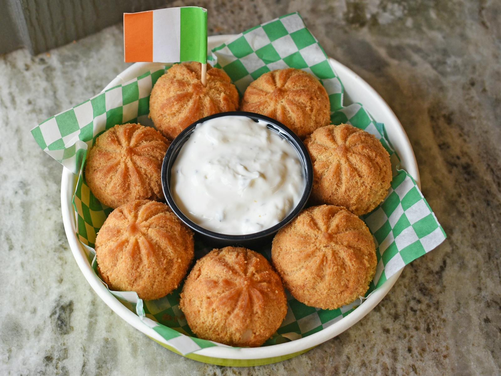 The Pot O' Gold Potato Dumplings features cheesy garlic mashed potatoes folded into dumplings from Saturday Dumpling Co. and deep fried.