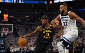 Golden State Warriors forward Jimmy Butler III drives against Timberwolves center Rudy Gobert (27) in the first quarter in Game 1 of their NBA Western