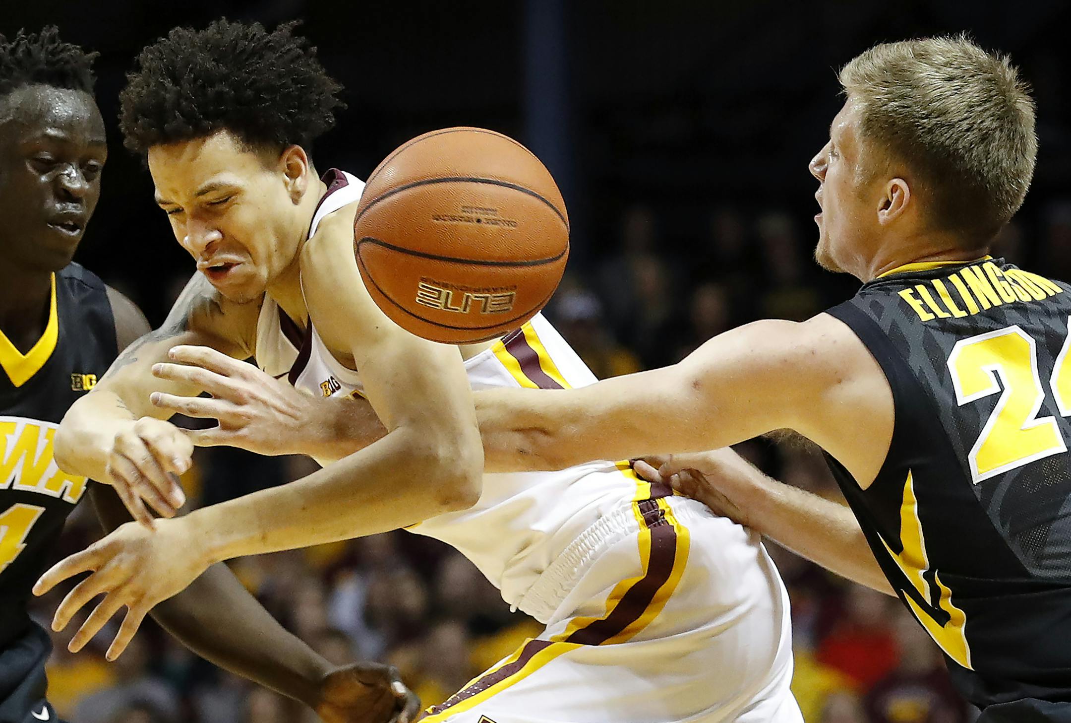 Amir Coffey (5) was fouled by Brady Ellingson (24) in the second half. ] CARLOS GONZALEZ ï cgonzalez@startribune.com - February 8, 2017, Minneapolis, MN, Williams Arena, NCAA Basketball, University of Minnesota Gophers vs. Iowa Hawkeyes