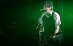 Michael Clifford of 5 Seconds of Summer performed at Xcel Energy Center in St. Paul, Minn. on Friday July 31, 2015. ] RACHEL WOOLF &#xb7; rachel.woolf
