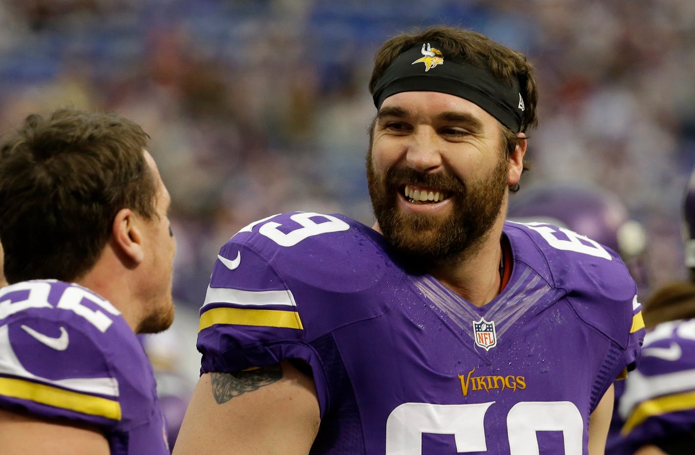 FILE - In this Dec. 29, 2013 file photo, Minnesota Vikings outside linebacker Chad Greenway, left, laughs with teammate Jared Allen before an NFL football game against the Detroit Lions, in Minneapolis. The Minnesota Vikings have signed defensive end Jared Allen to a ceremonial one-day contract to allow the four-time All-Pro to formally retire as a member of the team. The Vikings made the announcement Thursday, April 14, 2016. (AP Photo/Ann Heisenfelt, File)