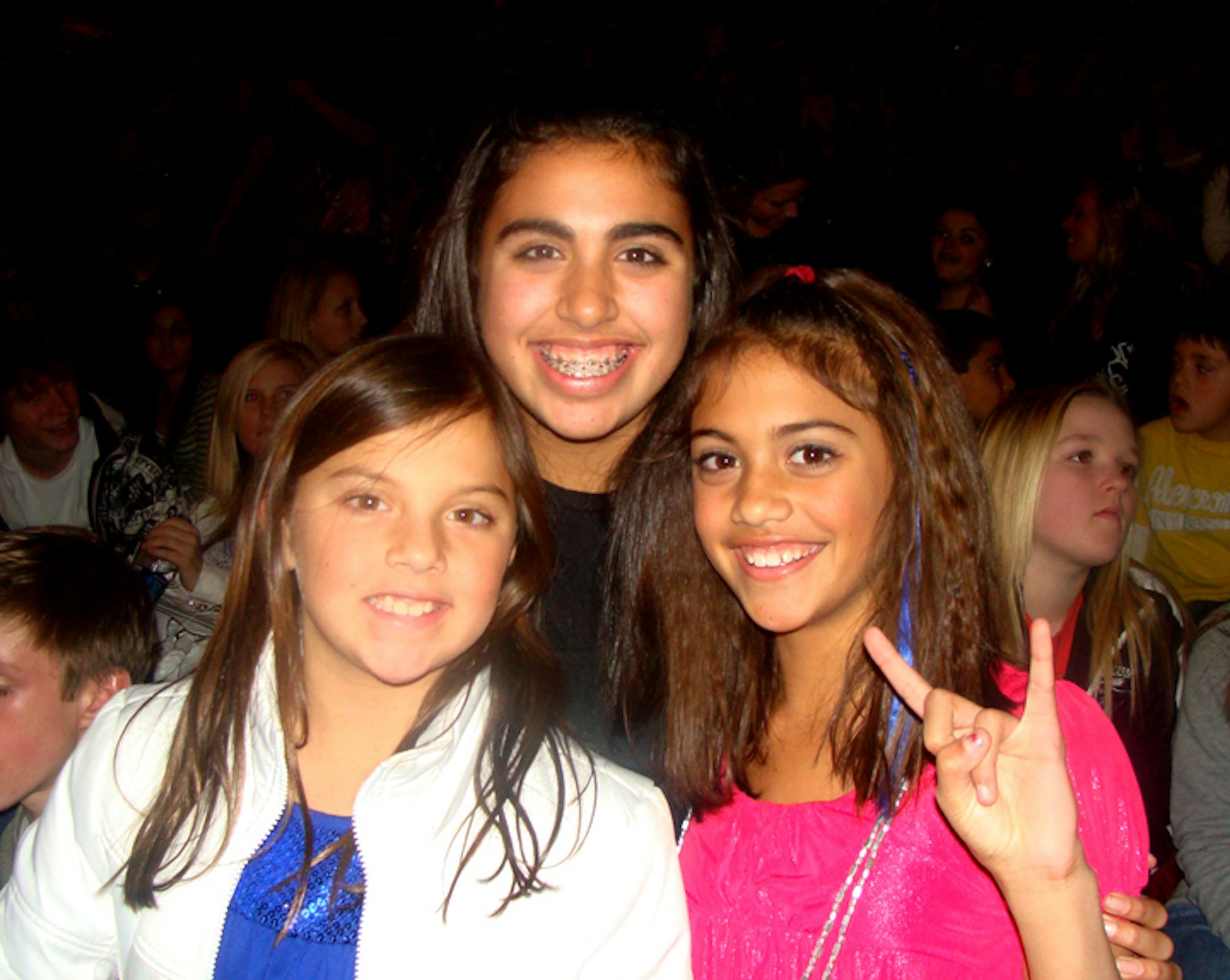Katey Brattland, 3rd grade; Georgie Brattland, 7th grade; and Samantha Brattland, 5th grade; sisters from Eden Prairie. On a normal Monday night, they would be at cheerleading practice at Planet Spirit. Their mom got the tickets as a reward for good grades.