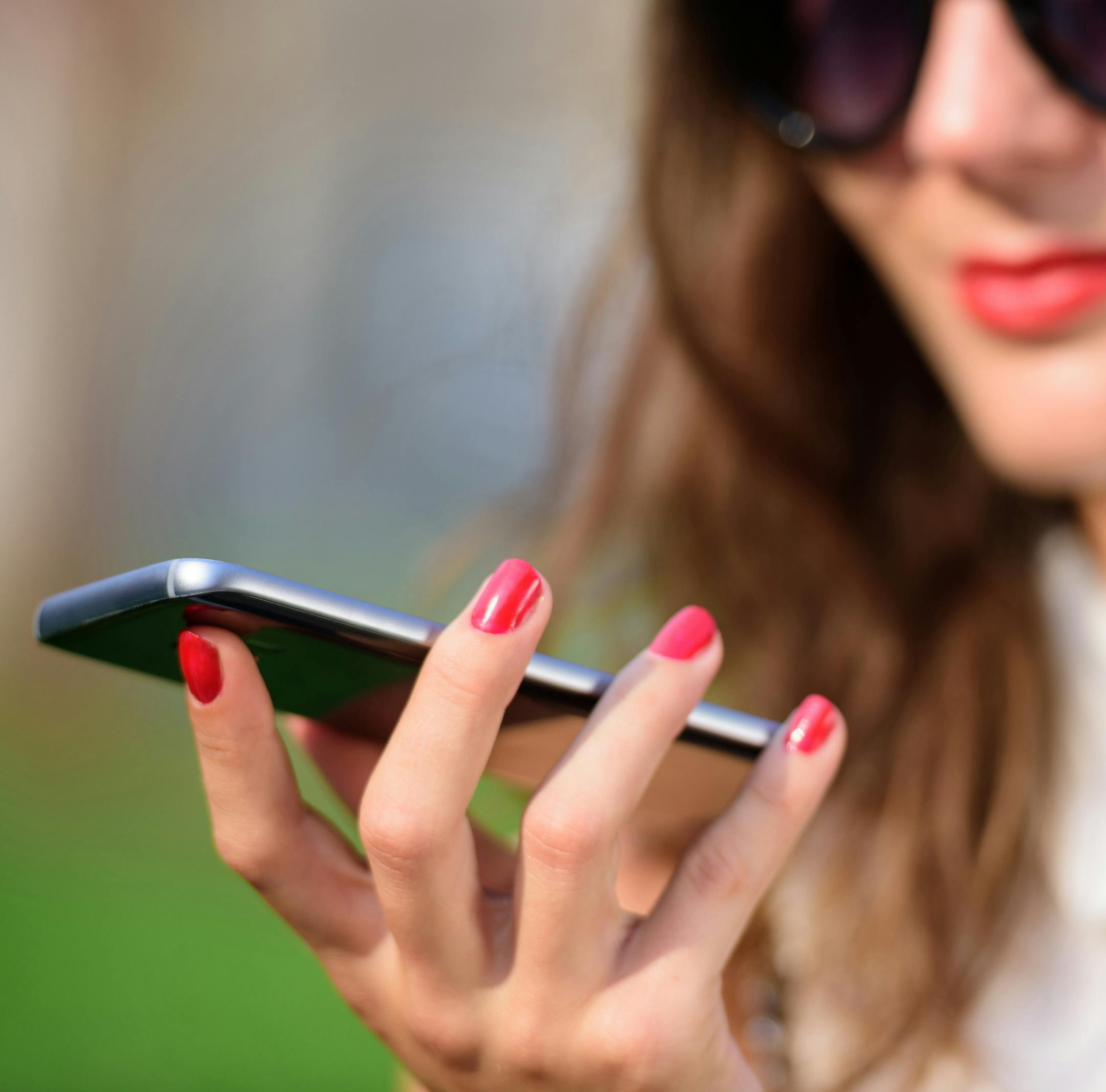 Portrait of young woman using mobile phone
istock