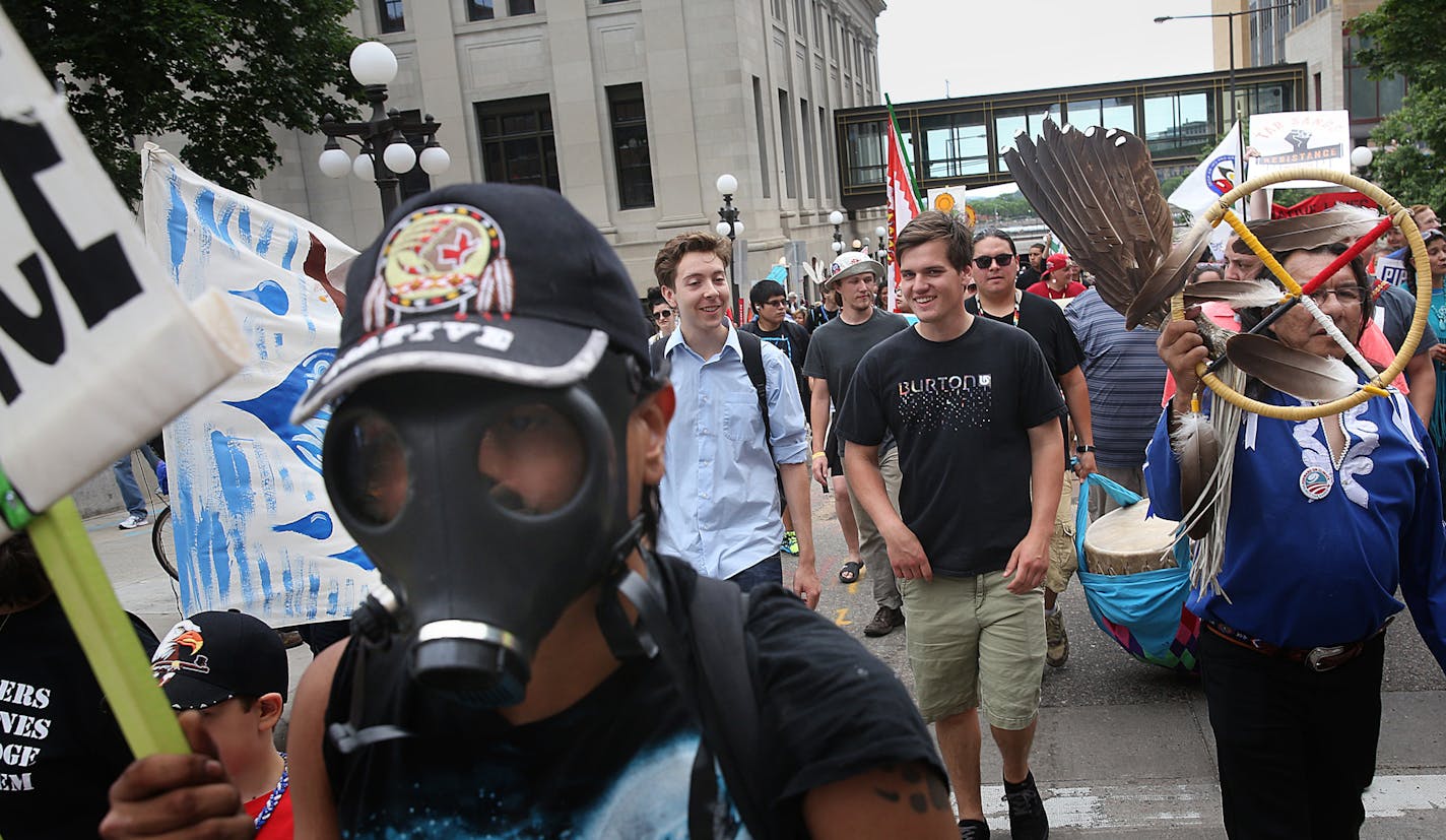 Demonstrators walk along toward the Capitol during a rally to protest Minnesota's proposed Sandpiper pipeline, Saturday, June 6, 2015, in St. Paul, Minn. The protestors are calling for the cancellation of the proposed Sandpiper oil pipeline that would travel near some of the state&#xed;s pristine waters. (Jim Gehrz/Star Tribune via AP) MANDATORY CREDIT; ST. PAUL PIONEER PRESS OUT; MAGS OUT; TWIN CITIES LOCAL TELEVISION OUT ORG XMIT: MIN2015060813285952