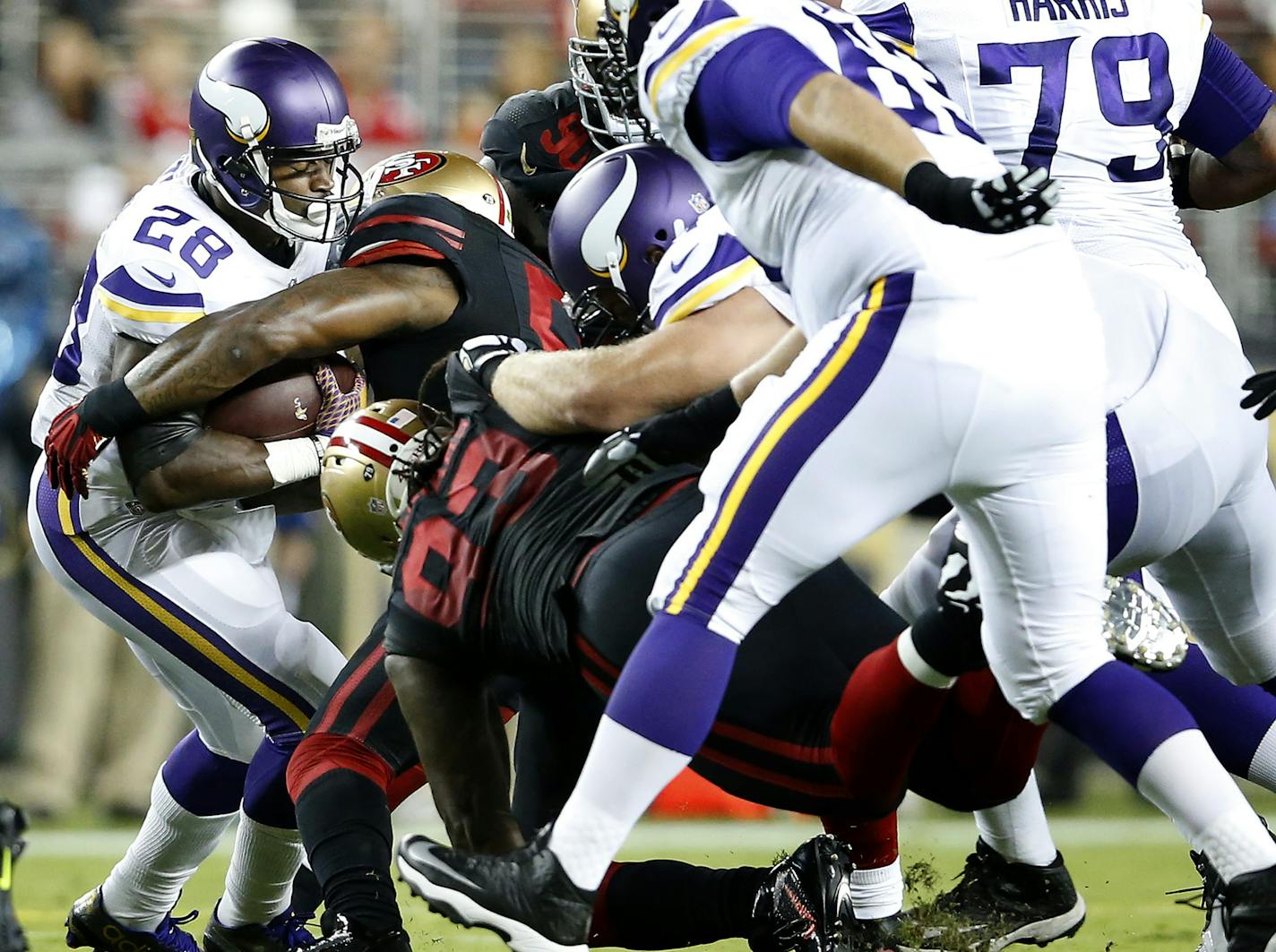 Minnesota Vikings running back Adrian Paterson (28) was stopped by San Francisco defenders in the first quarter. ] CARLOS GONZALEZ cgonzalez@startribune.com - September 14, 2015, Levi's Stadium, Santa Clara, CA, NFL, Minnesota Vikings vs. San Francisco 49ers, Monday Night Football