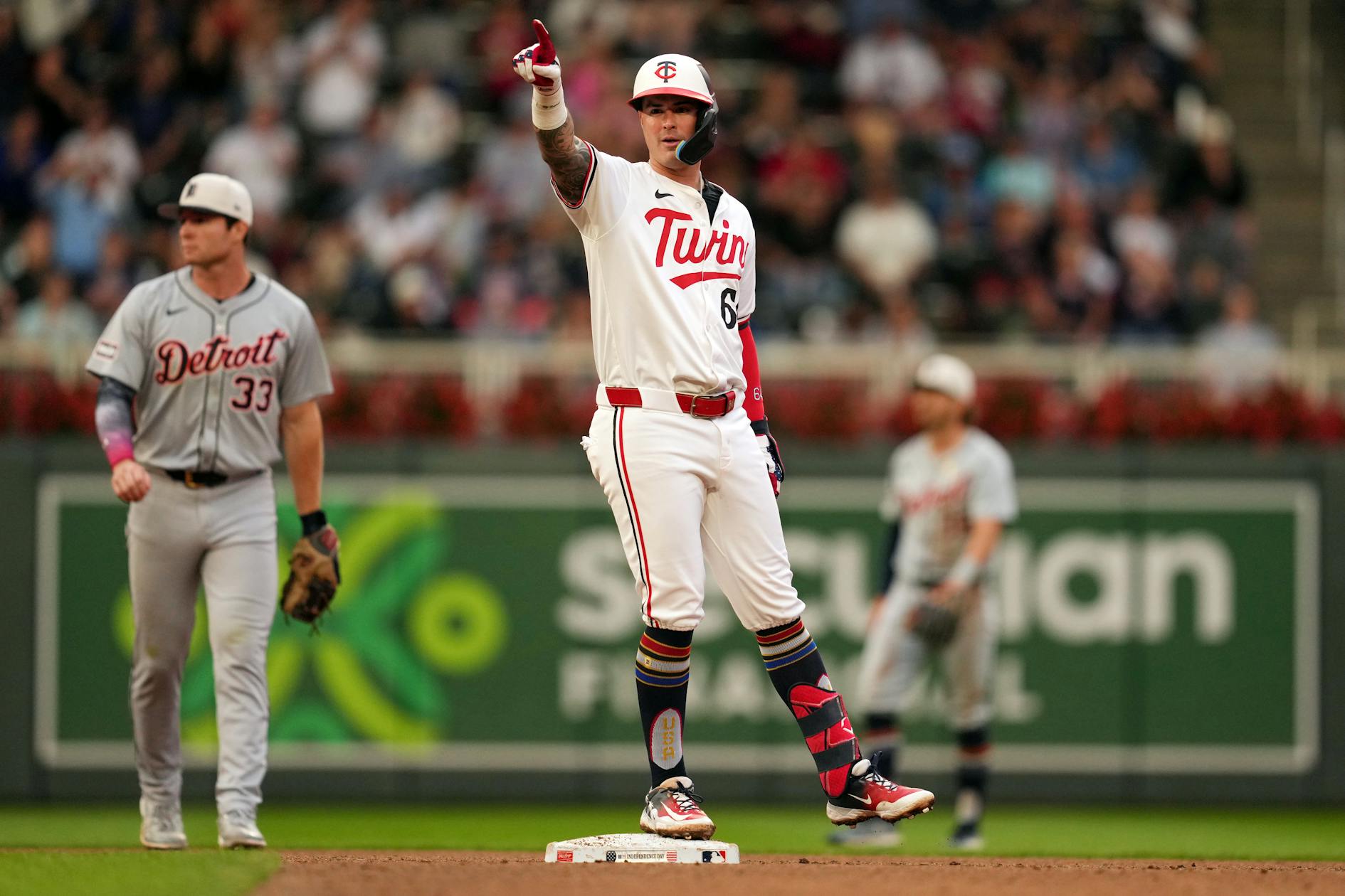 Twins win in a rain-shortened Fourth of July romp, 12-3 over Tigers