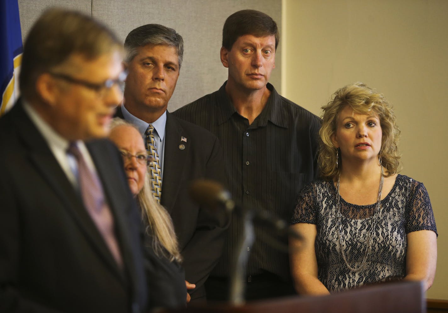 Attorney Erick Kaardal of Mohrman & Kaardal addresses media members as plaintiffs Deb and Jim Roschen, right to left, Rep. Steve Drazkowski and Beverly Snow look on Thursday, Sept 12, 2013, at the State Capitol, in St. Paul, MN.](DAVID JOLES/STARTRIBUNE) djoles@startribune.com Eighteen people from a southeastern Minnesota County including one legislator, two county board members and a several other local notables are filing suit in federal court on Thursday against 50 counties and municipalities