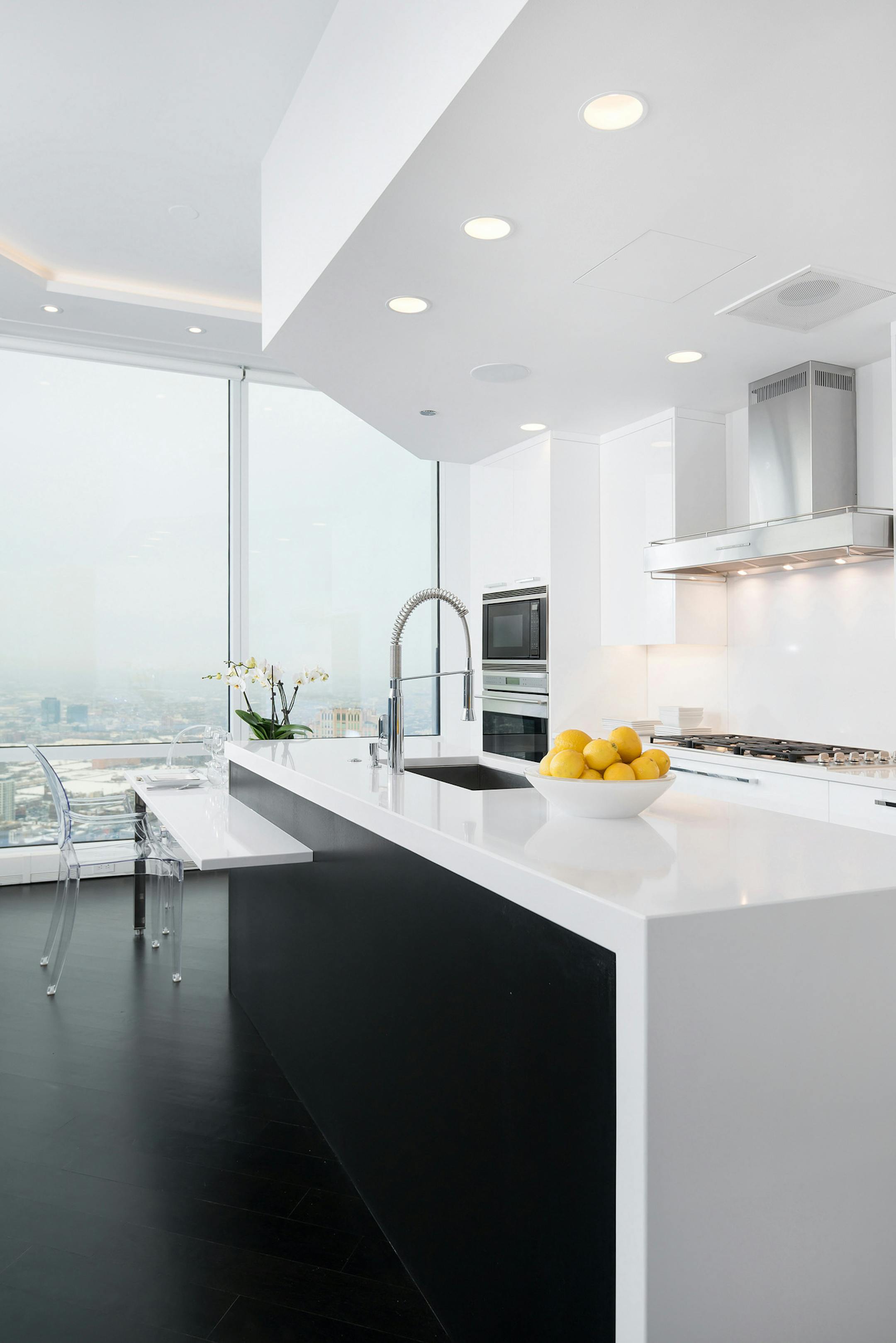 Chicago designer Scott Dresner designed a spanking white kitchen with high-gloss painted cabinets for a unit's contemporary vibe. (Jim Tschetter/Dresner Design) ORG XMIT: 1171943