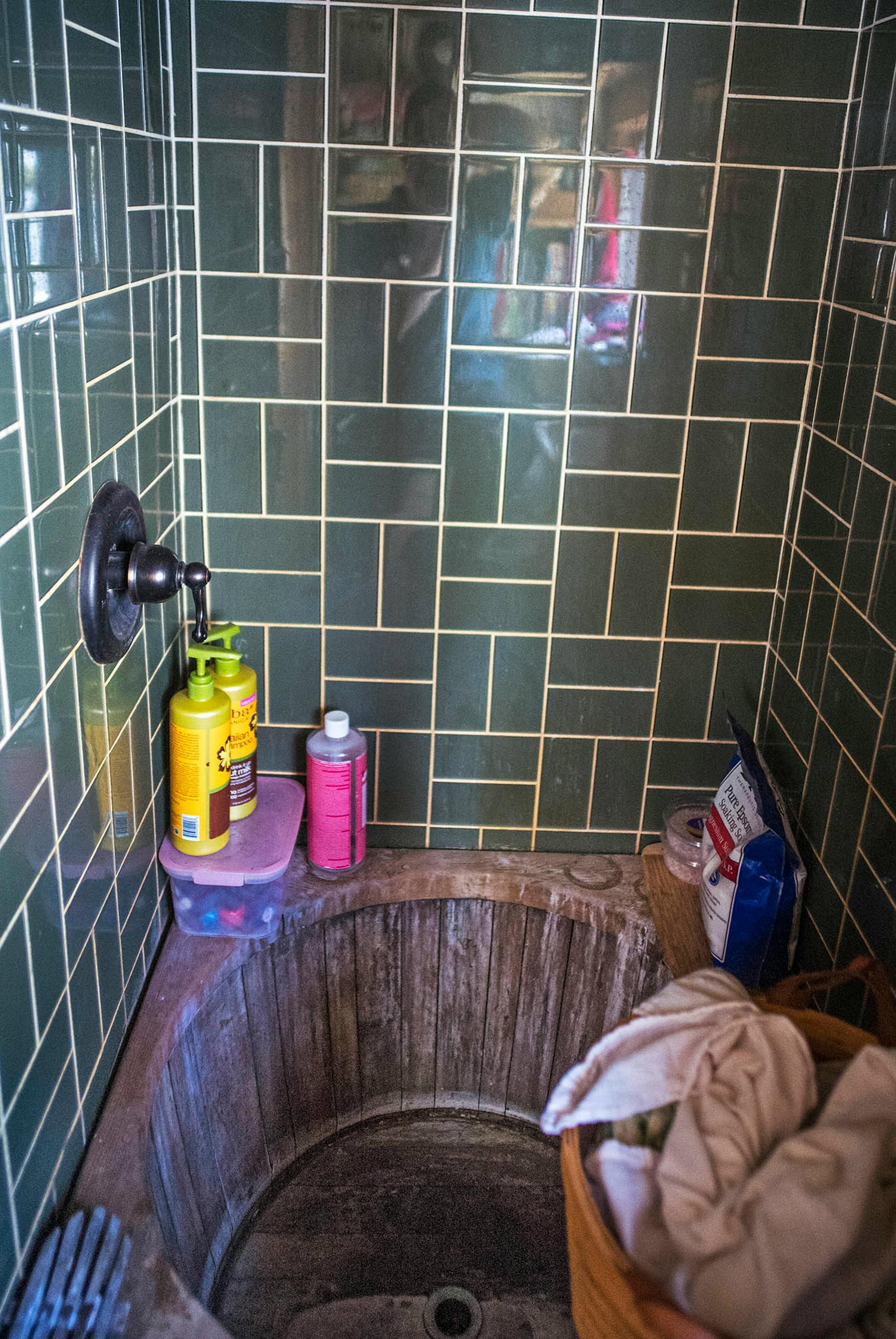 The Kasls' shower includes half a wine barrel that serves as a bathtub for the kids.